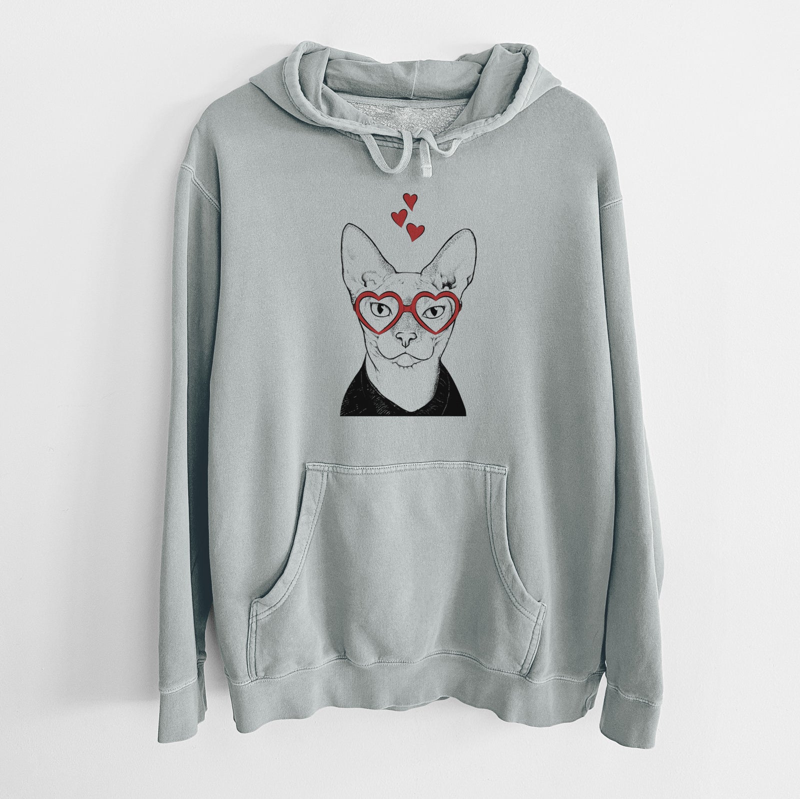 Hand-drawn sketch of Oliver Watson the Sphynx Cat wearing heart-shaped glasses on a Sage Unisex pigment dyed hoodie