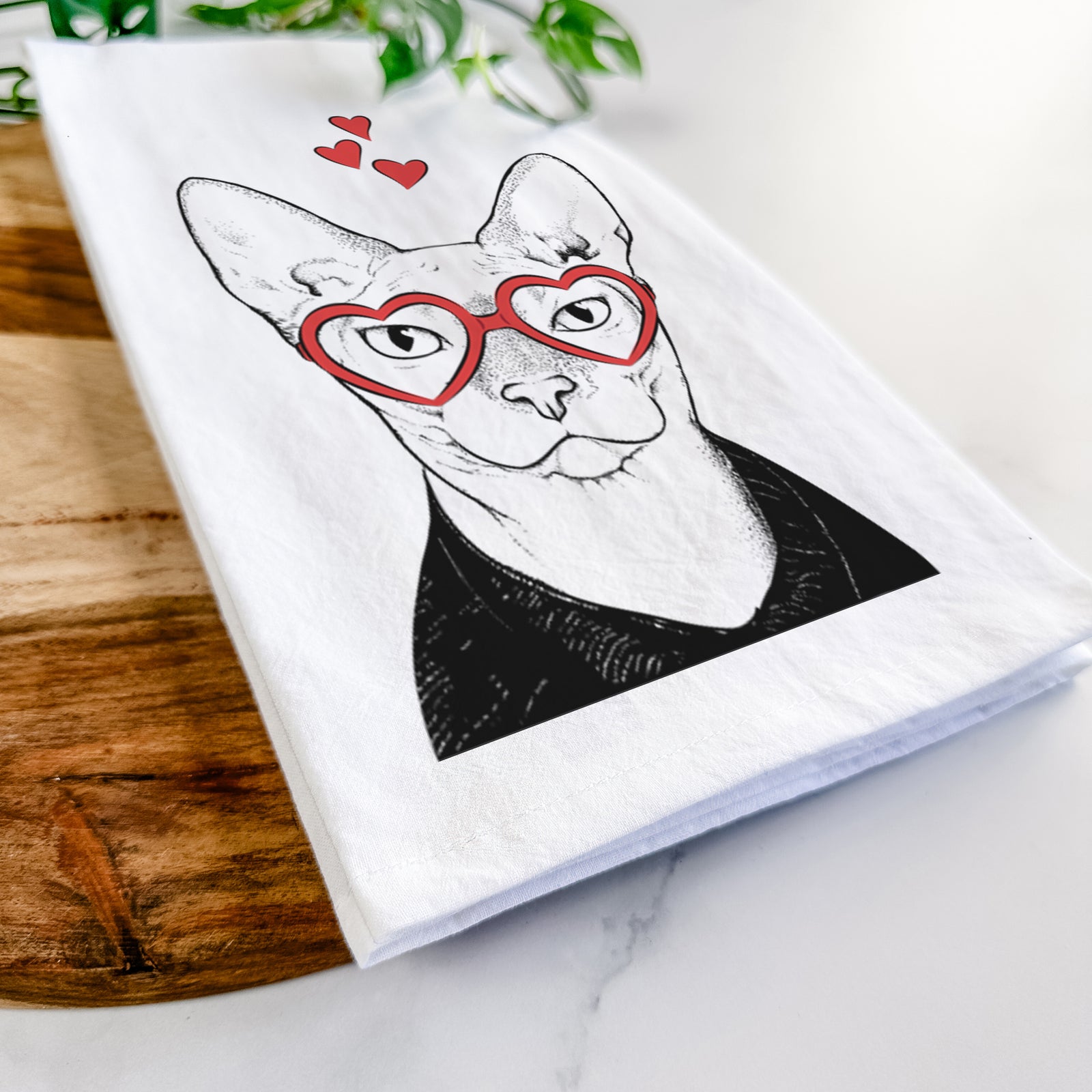 Hand-drawn sketch of Oliver Watson the Sphynx Cat wearing heart-shaped glasses on a tea towel