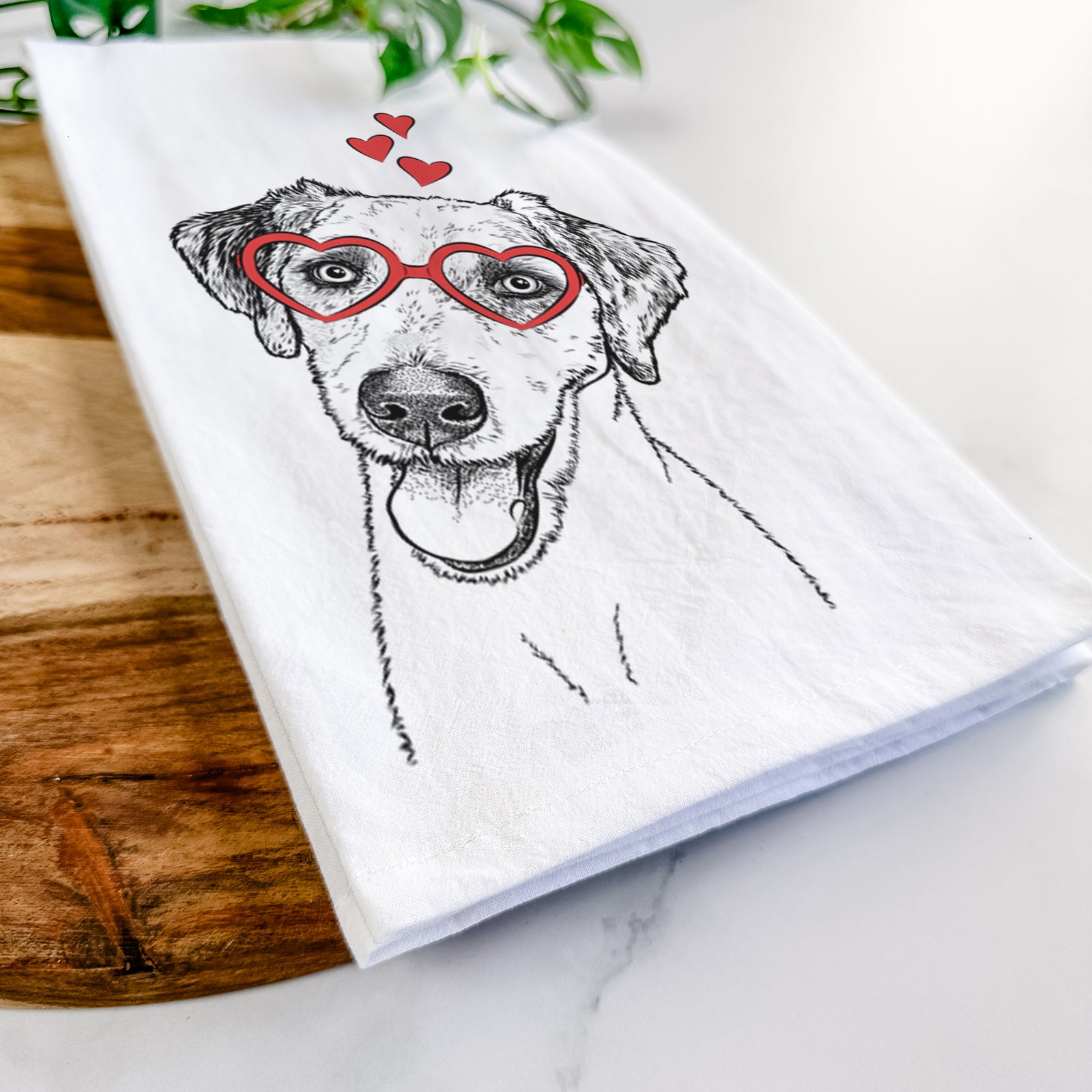 Hand-drawn sketch of Palm Palm the Aussiedoodle wearing heart-shaped glasses on a tea towel