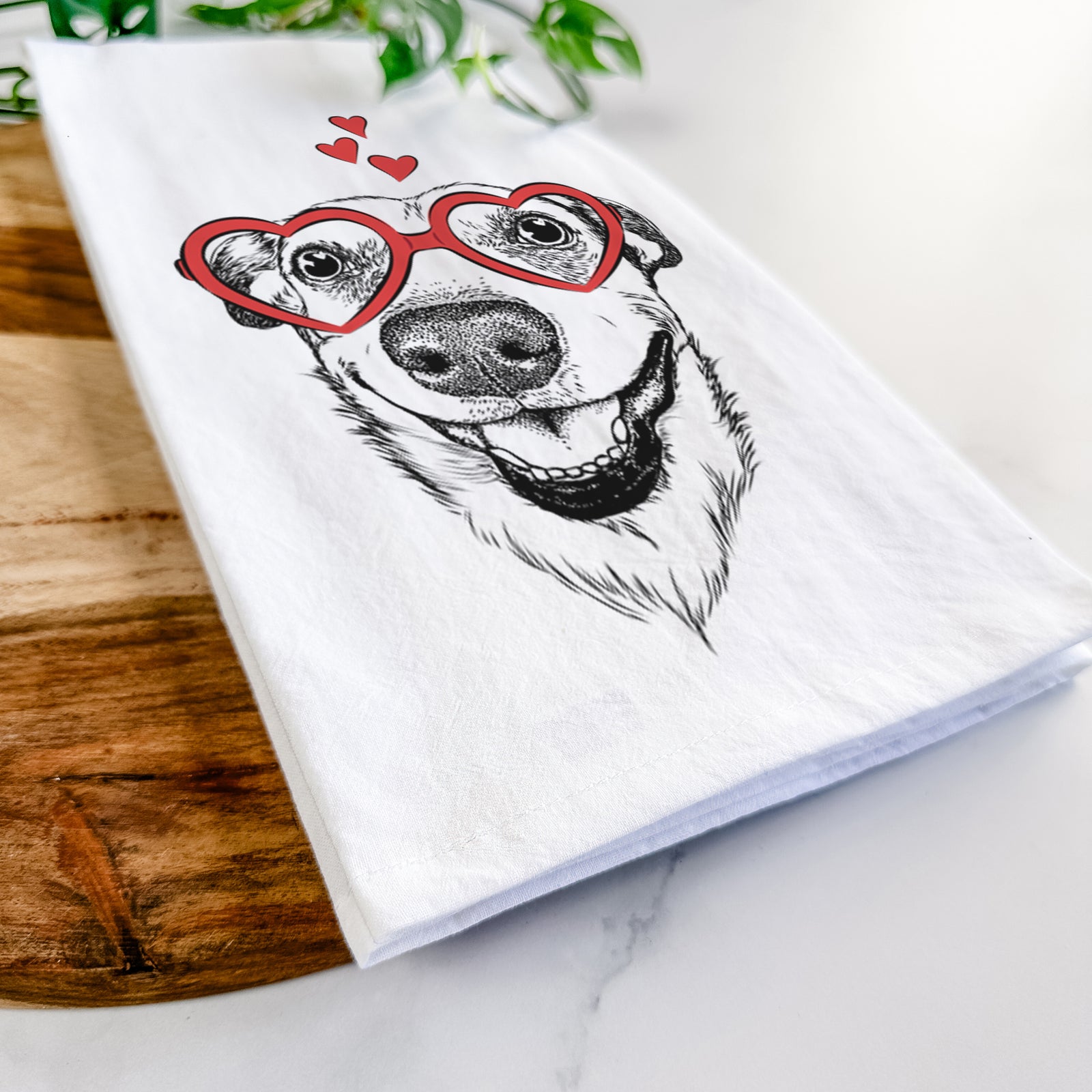 Hand-drawn sketch of Petrah the Staffy Mix wearing heart-shaped glasses on a tea towel