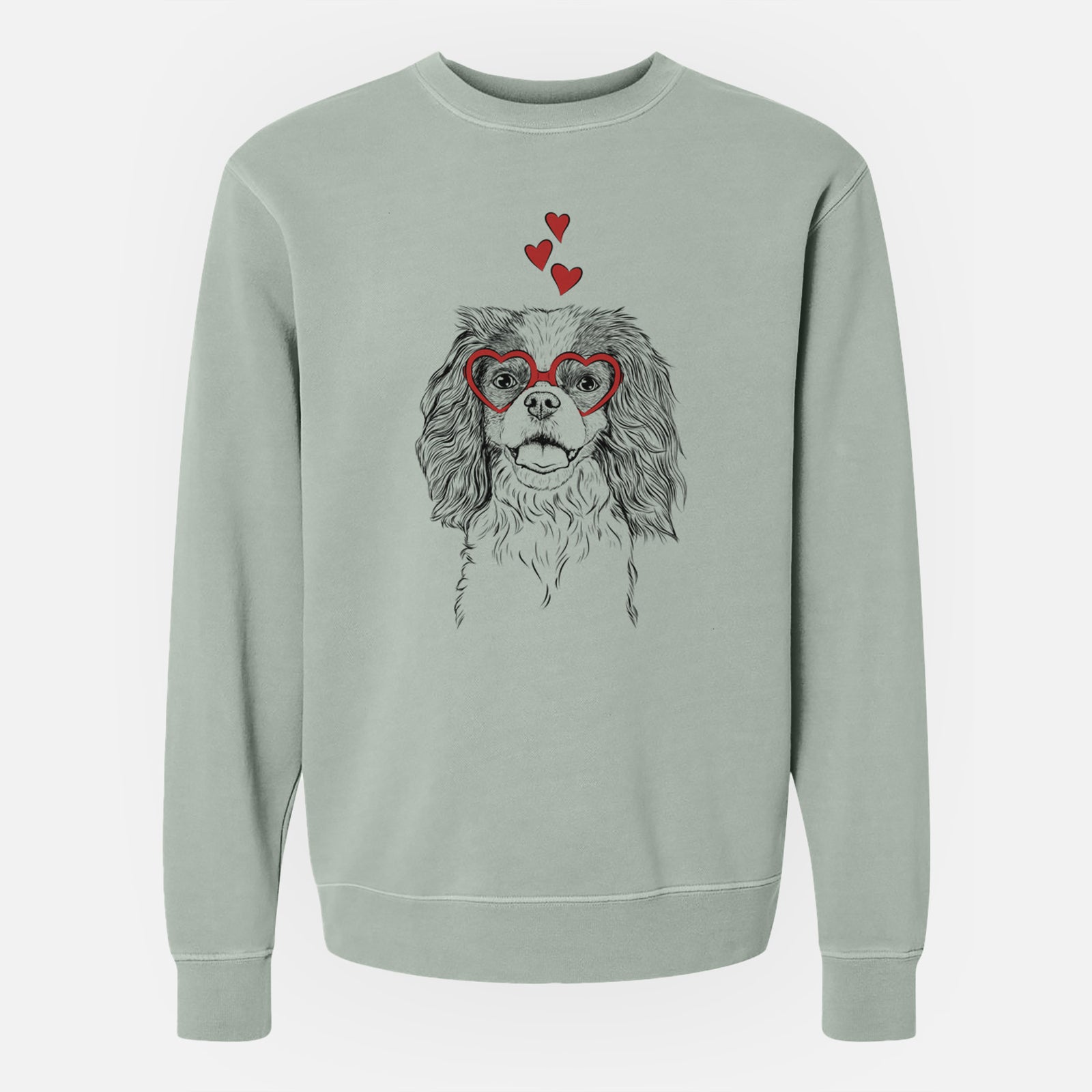 Hand-drawn sketch of Poppy the Cavalier King Charles Spaniel wearing heart-shaped glasses on a Sage Unisex pigment dyed crew sweatshirt