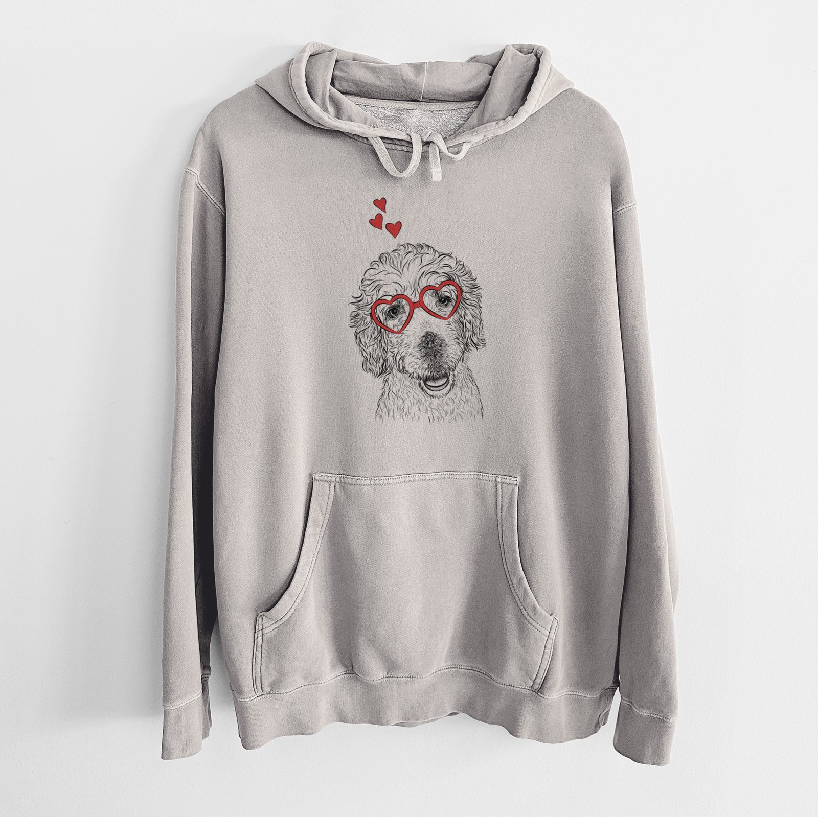 Hand-drawn sketch of Preston the Labradoodle wearing heart-shaped glasses on a Cement Unisex pigment dyed hoodie