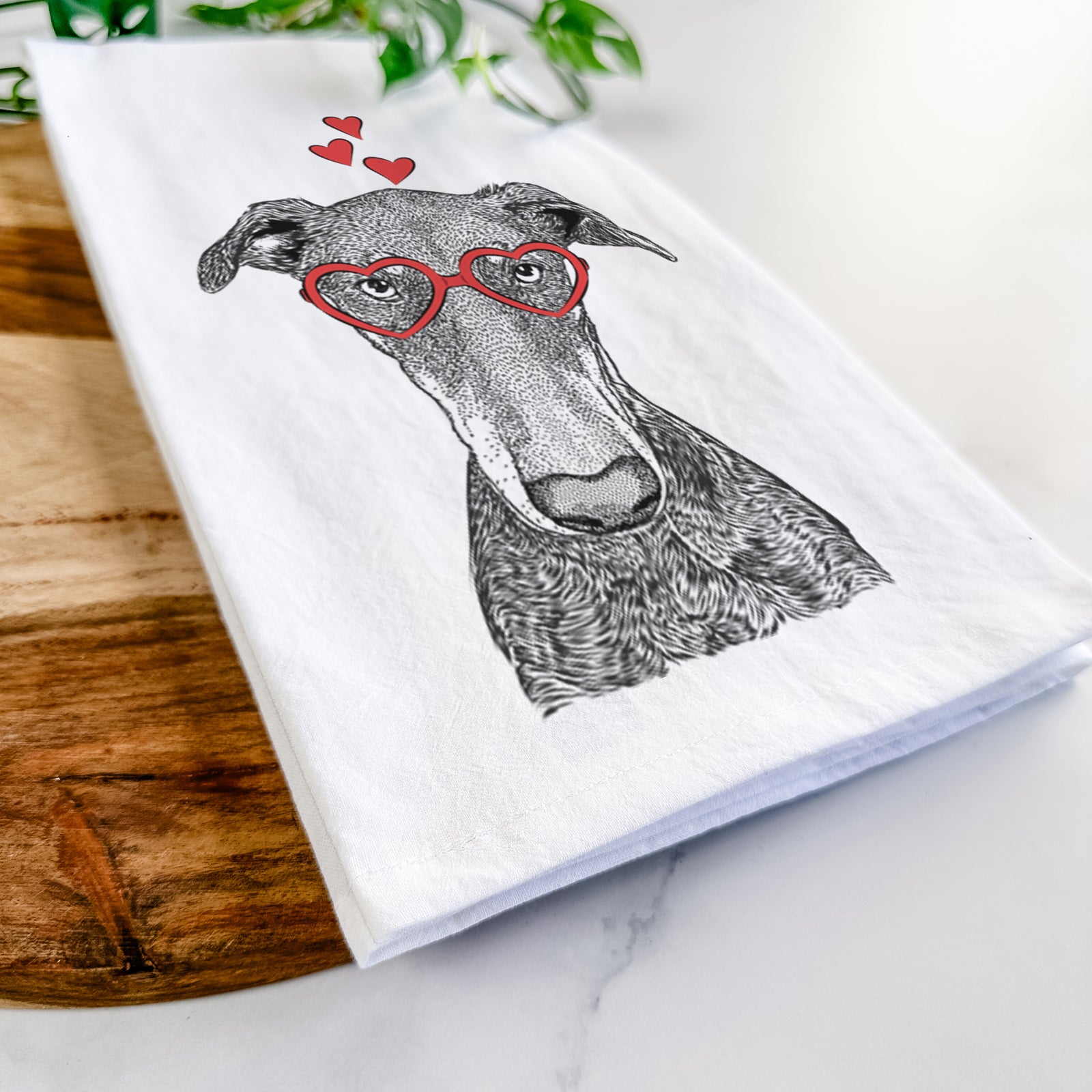 Hand-drawn sketch of Princess Fiona the Doberman Pinscher wearing heart-shaped glasses on a tea towel