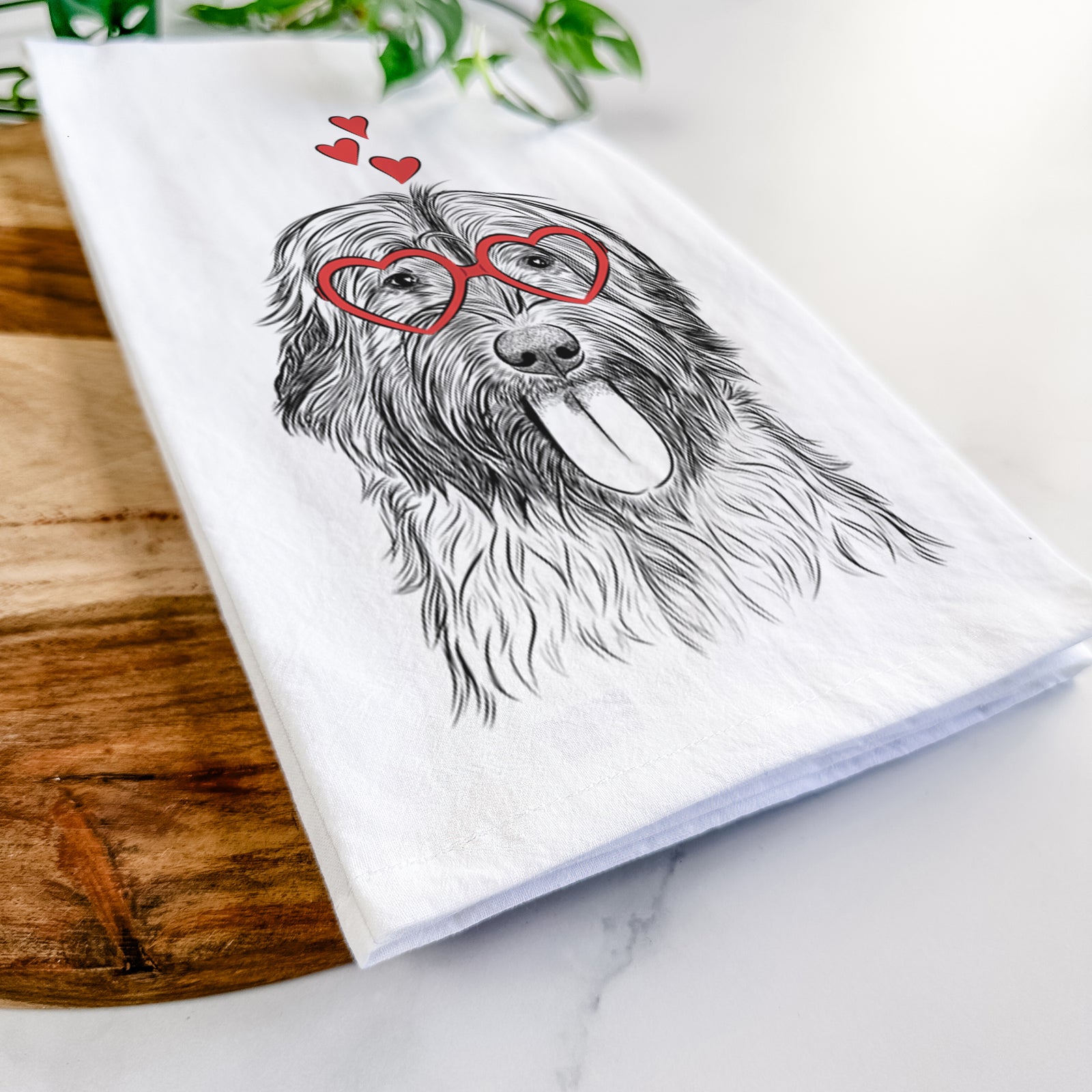 Hand-drawn sketch of Puig the Catalan Sheepdog wearing heart-shaped glasses on a tea towel