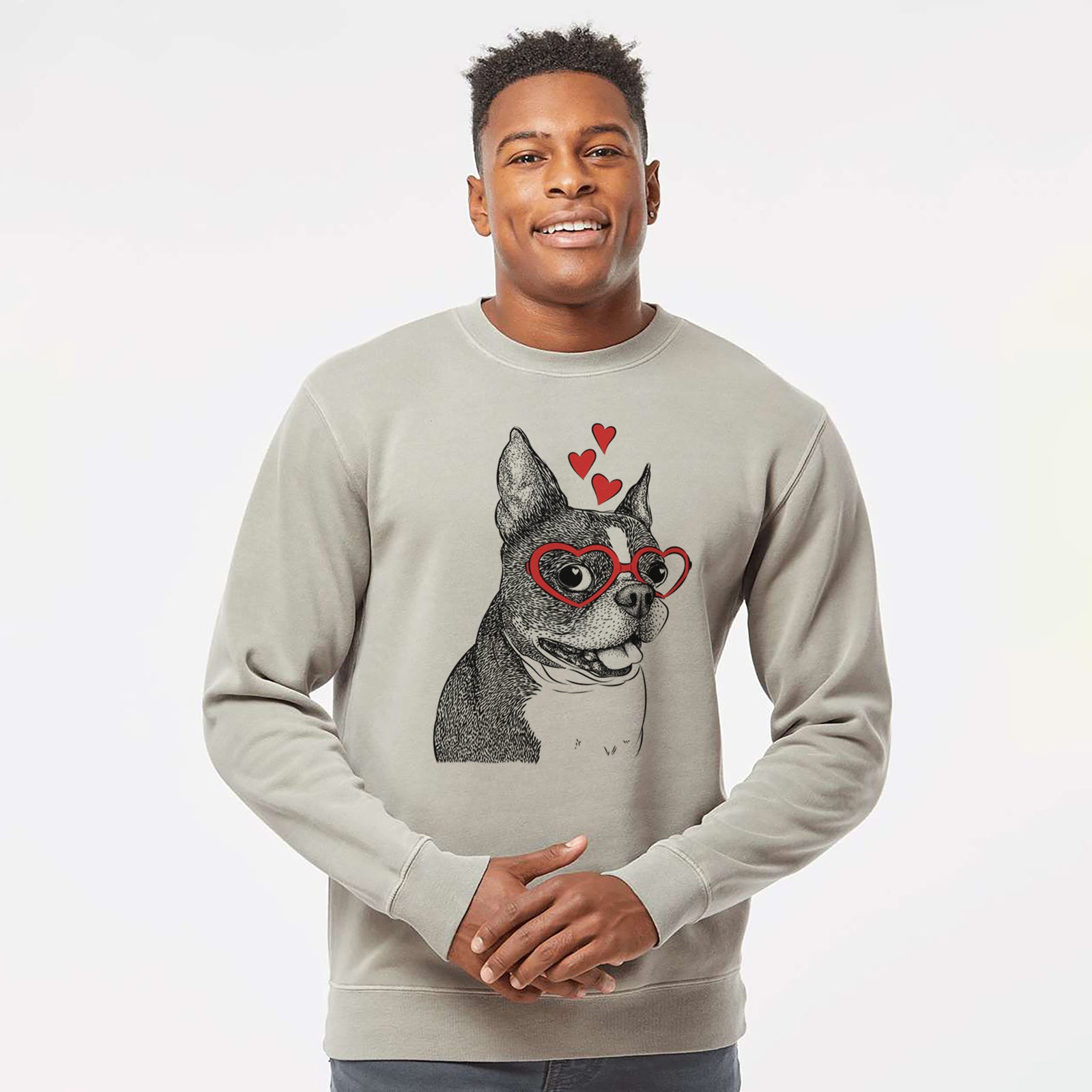 Hand-drawn sketch of Ralphie the Boston Terrier wearing heart-shaped glasses on a Cement Unisex pigment dyed crew sweatshirt