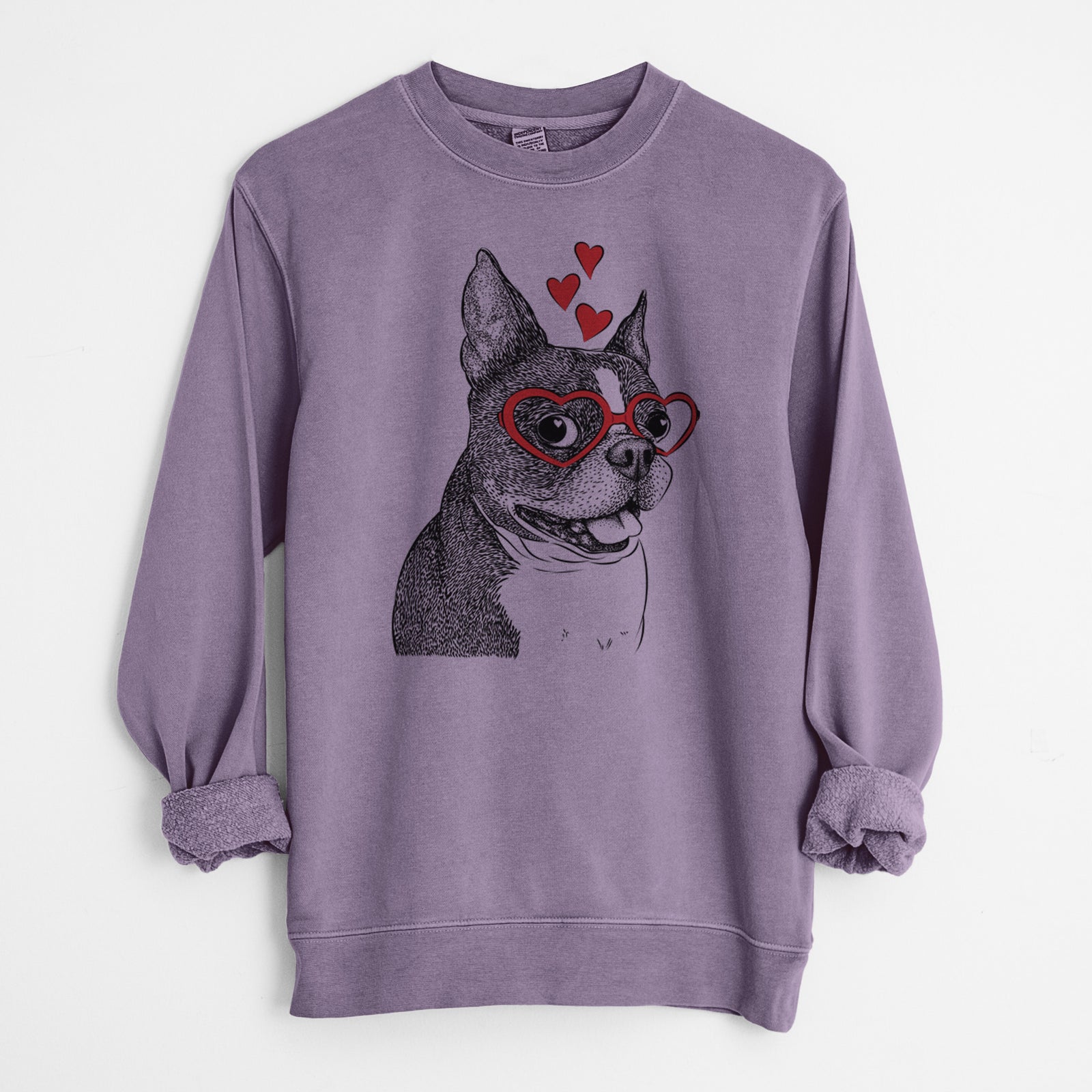 Hand-drawn sketch of Ralphie the Boston Terrier wearing heart-shaped glasses on a Plum Unisex pigment dyed crew sweatshirt