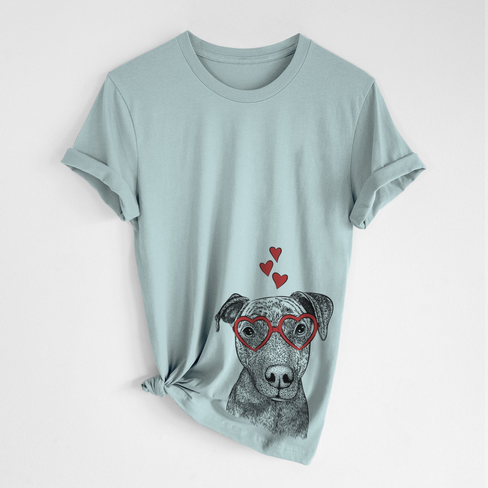 Hand-drawn sketch of Reeses the Pitbull wearing heart-shaped glasses on a Dusty Blue Unisex crewneck, worn by a woman