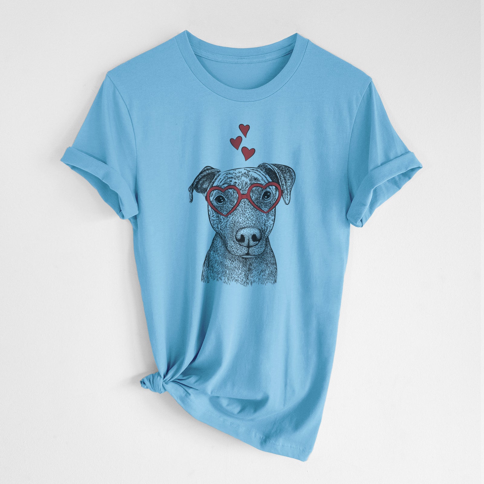 Hand-drawn sketch of Reeses the Pitbull wearing heart-shaped glasses on an Ocean Blue Unisex crewneck, worn by a woman