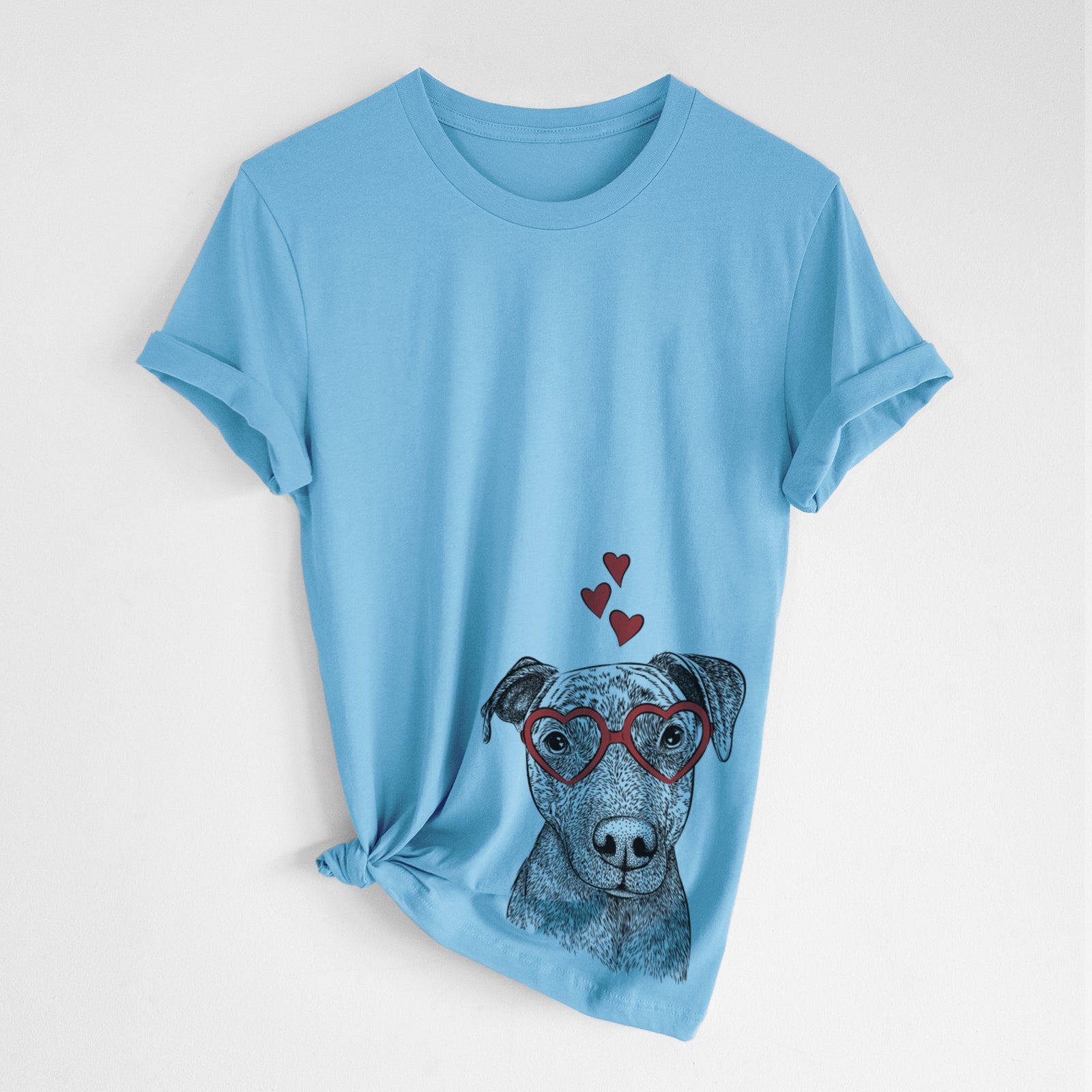 Hand-drawn sketch of Reeses the Pitbull wearing heart-shaped glasses on an Ocean Blue Unisex crewneck, worn by a woman