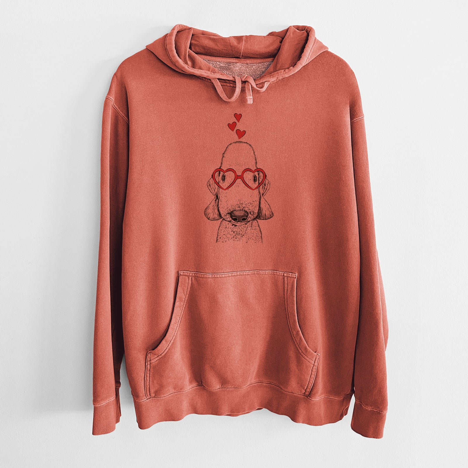Hand-drawn sketch of Remington the Bedlington Terrier wearing heart-shaped glasses on an Amber Unisex pigment dyed hoodie