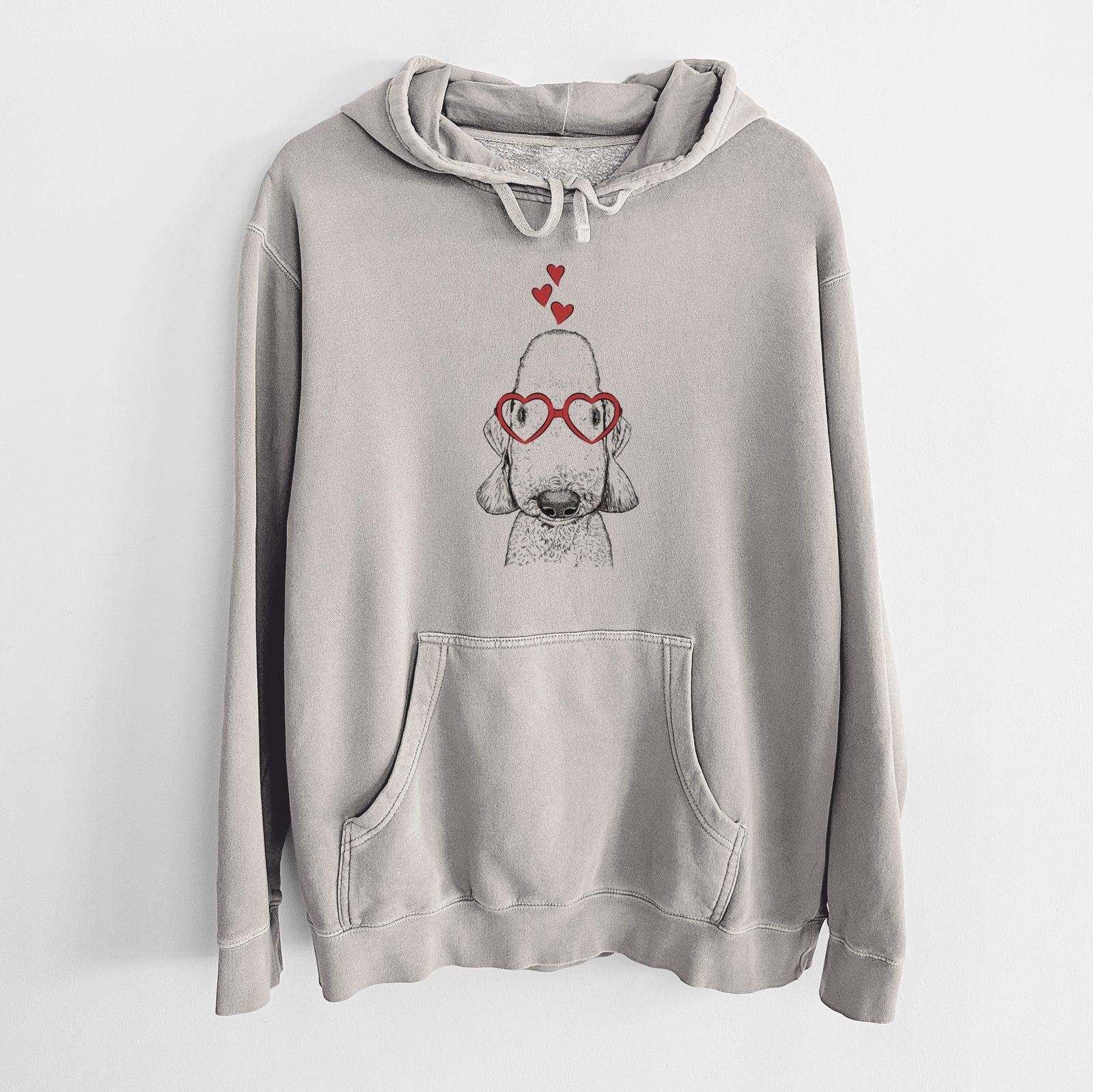 Hand-drawn sketch of Remington the Bedlington Terrier wearing heart-shaped glasses on a Cement Unisex pigment dyed hoodie