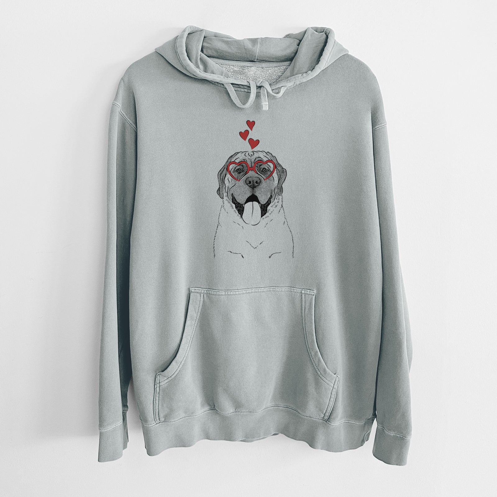 Hand-drawn sketch of Remmie the English Mastiff wearing heart-shaped glasses on a Sage Unisex pigment dyed hoodie