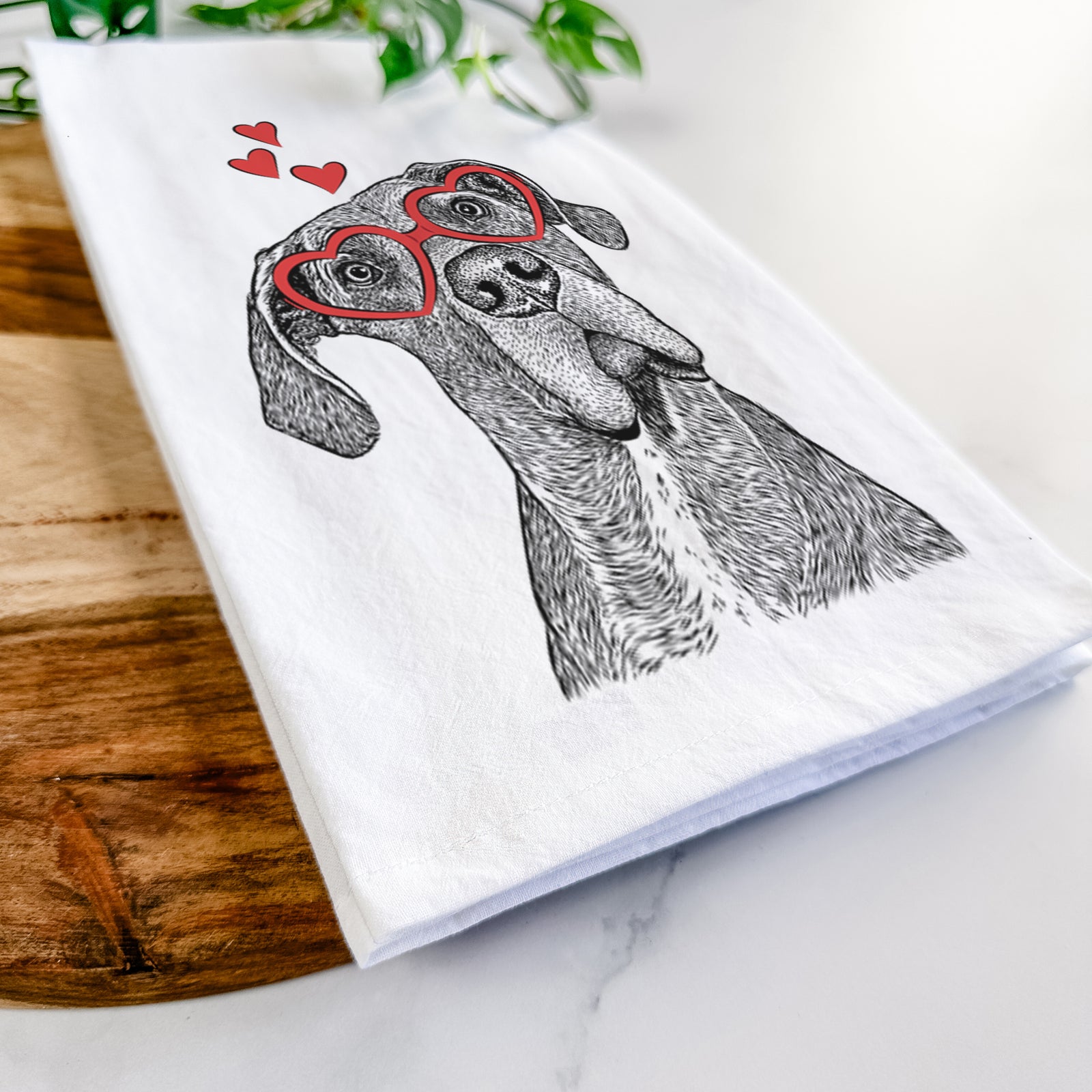 Hand-drawn sketch of River the Great Dane wearing heart-shaped glasses on a tea towel