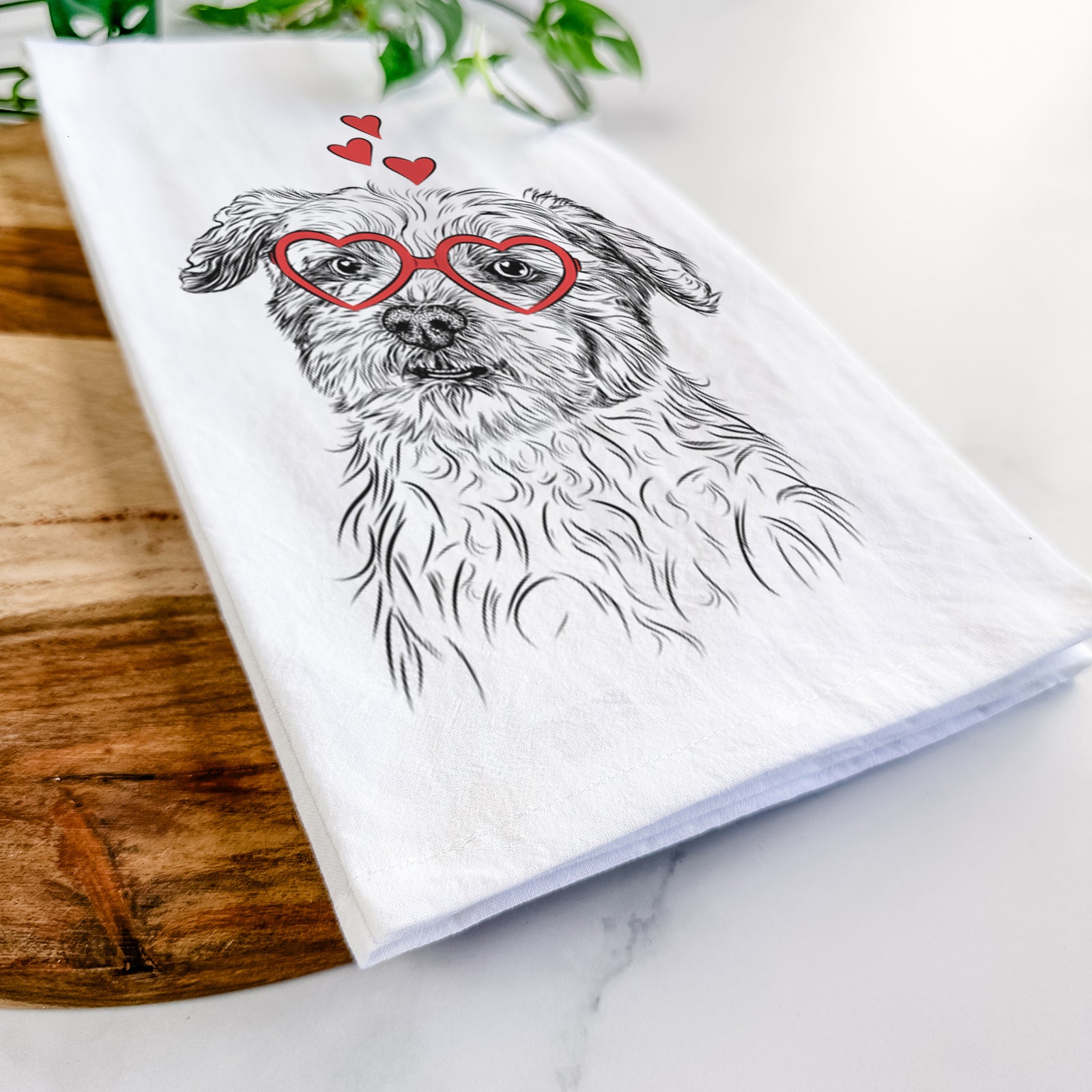 Hand-drawn sketch of Roxie the Schnauzer Shih Tzu Mix wearing heart-shaped glasses on a tea towel