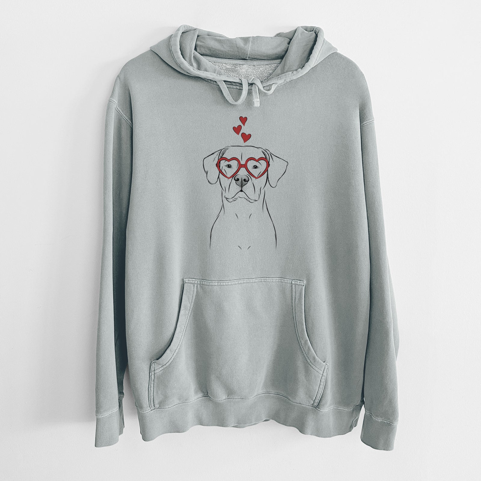 Hand-drawn sketch of Rufio the Dogo Argentino wearing heart-shaped glasses on a Sage Unisex pigment dyed hoodie