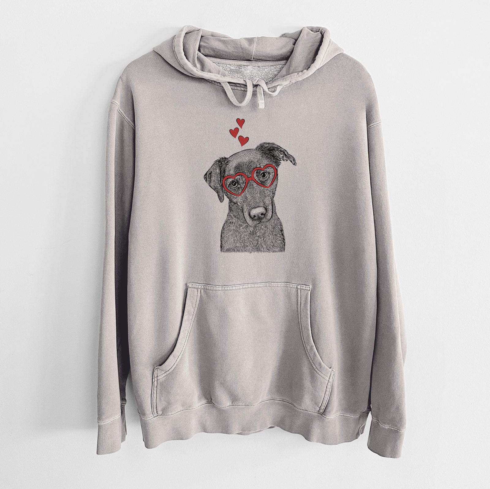 Hand-drawn sketch of Sadie the Whipador wearing heart-shaped glasses on a Cement Unisex pigment dyed hoodie