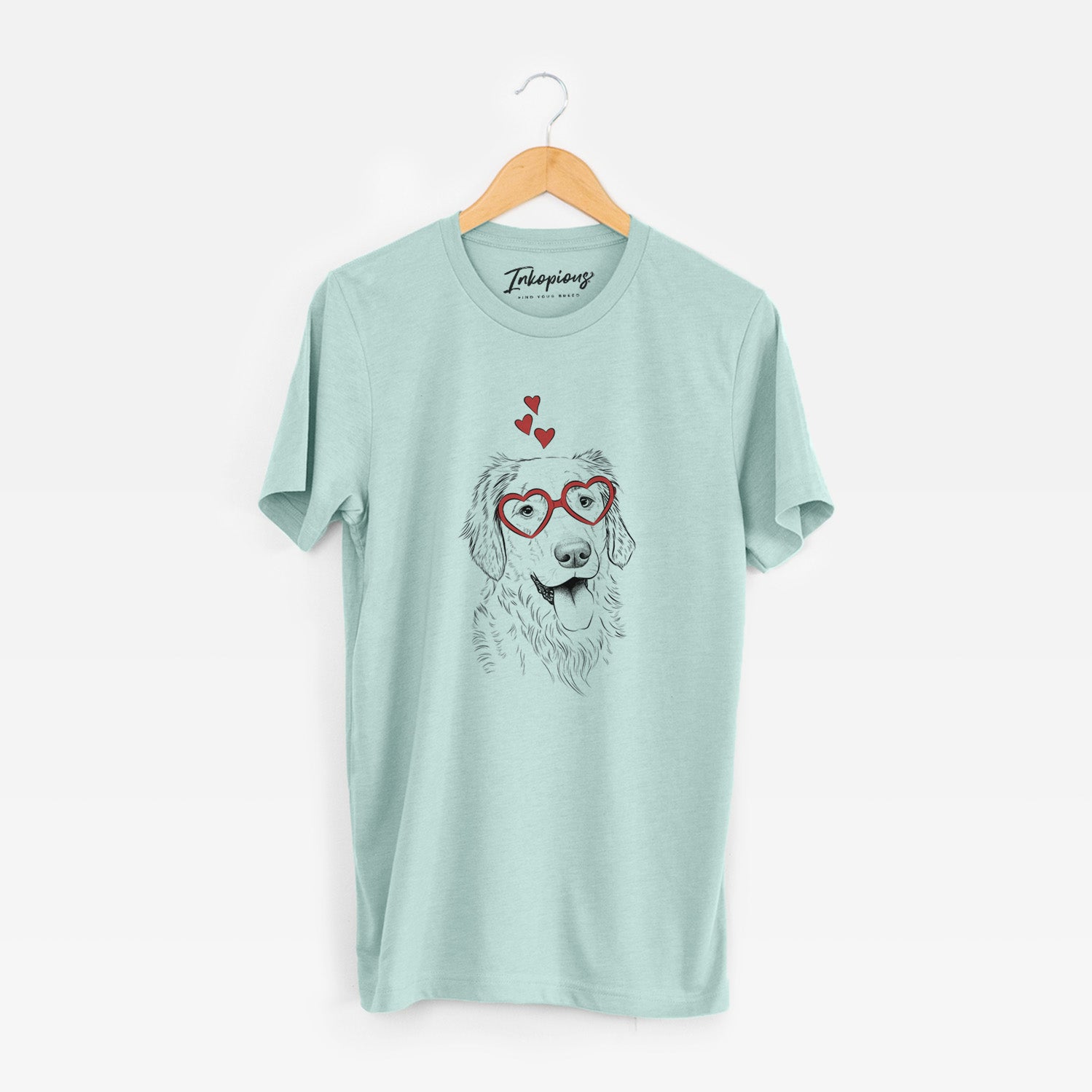 Hand-drawn sketch of Semba the Golden Retriever wearing heart-shaped glasses on a Heather Sage Unisex crewneck