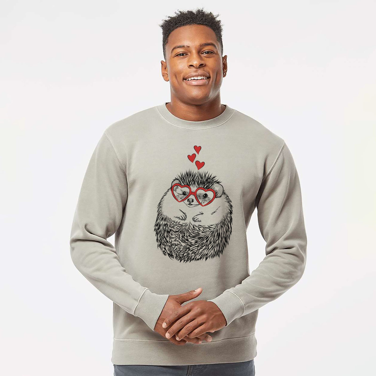 Hand-drawn sketch of Sid the Hedgehog wearing heart-shaped glasses on a Cement Unisex pigment dyed crew sweatshirt