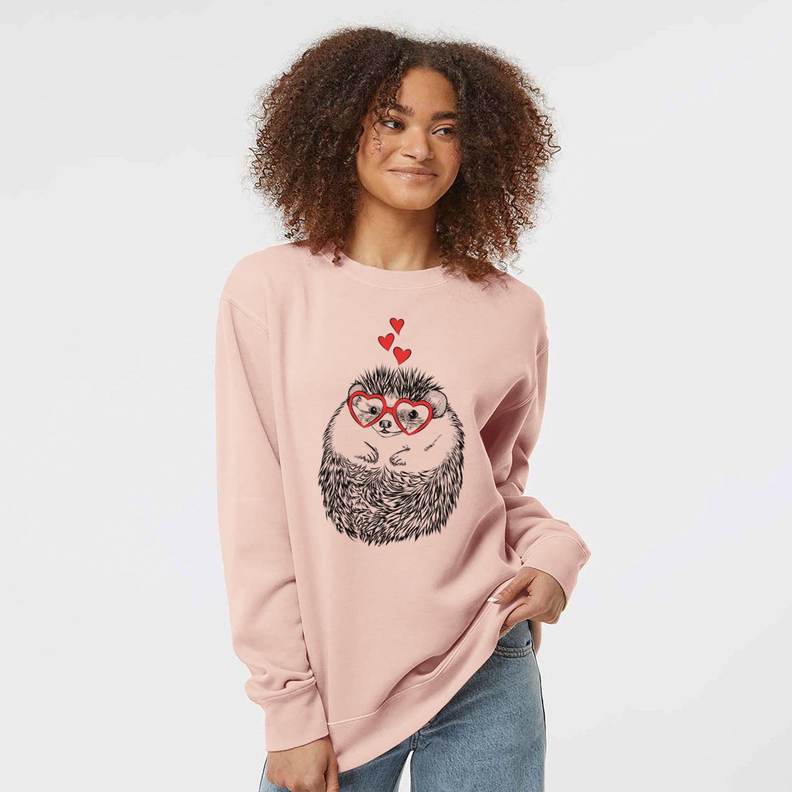 Hand-drawn sketch of Sid the Hedgehog wearing heart-shaped glasses on a Dusty Pink Unisex pigment dyed crew sweatshirt