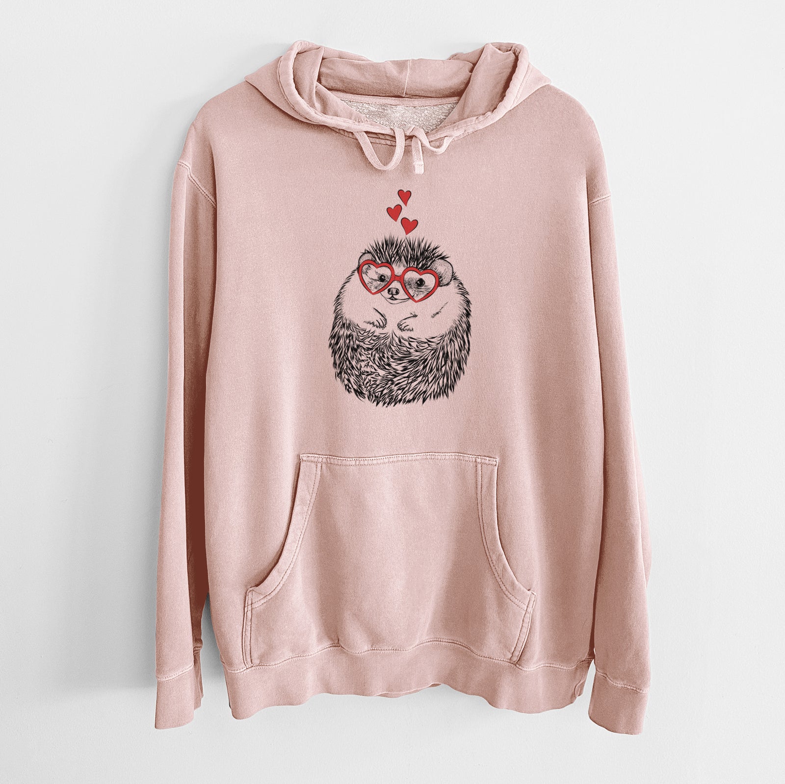 Hand-drawn sketch of Sid the Hedgehog wearing heart-shaped glasses on a Dusty Pink Unisex pigment dyed hoodie