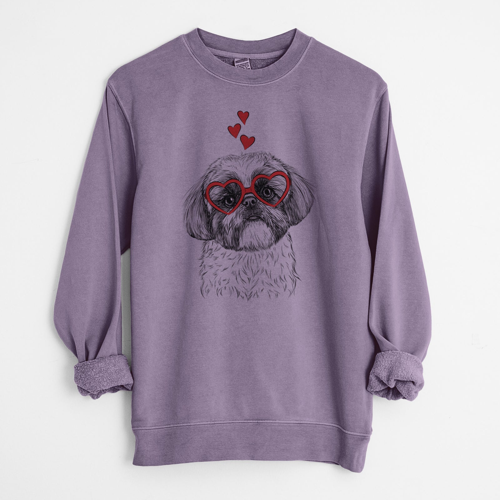 Hand-drawn sketch of Simon the Shih Tzu wearing heart-shaped glasses on a Plum Unisex pigment dyed crew sweatshirt