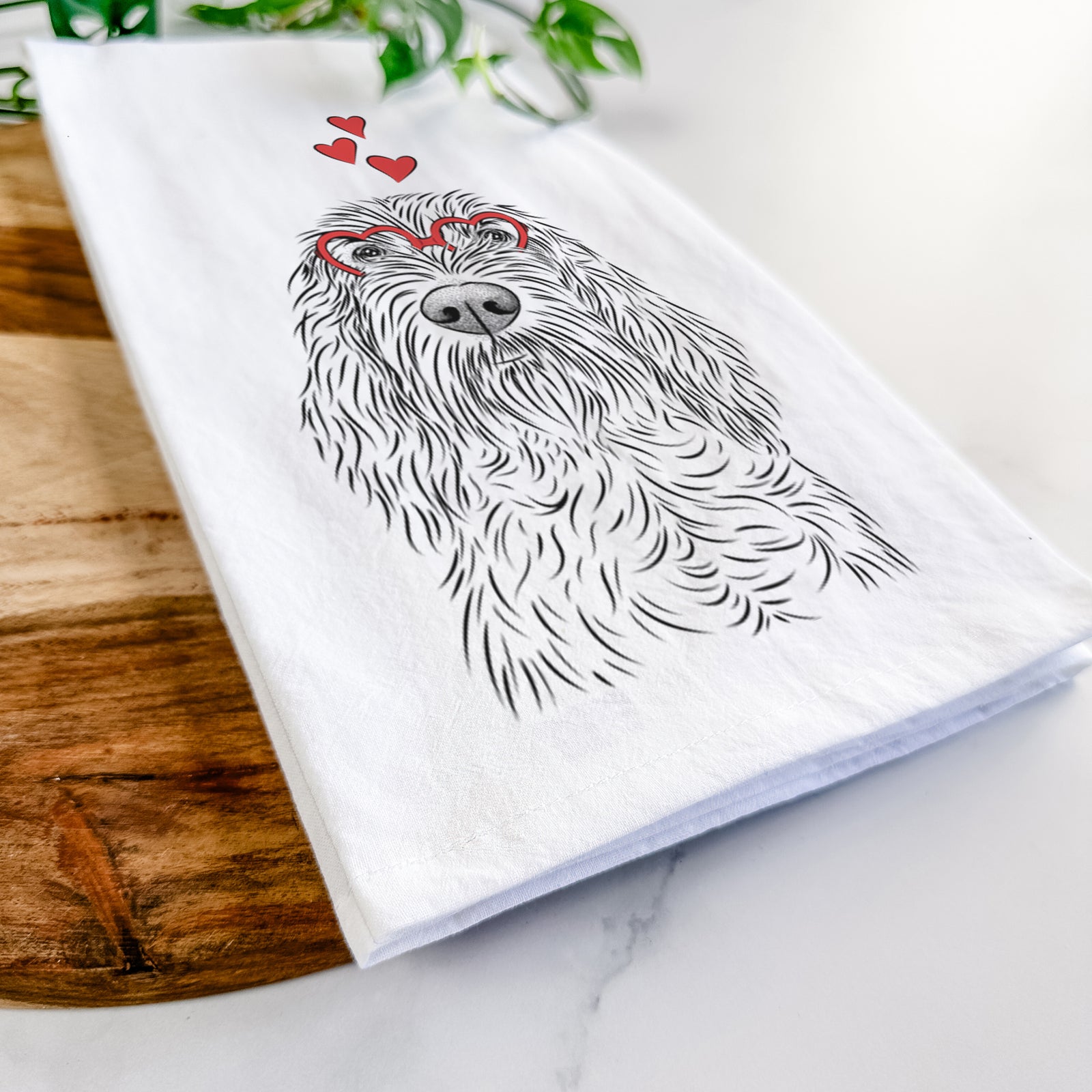 Hand-drawn sketch of Stefano the Spinone Italiano wearing heart-shaped glasses on a tea towel