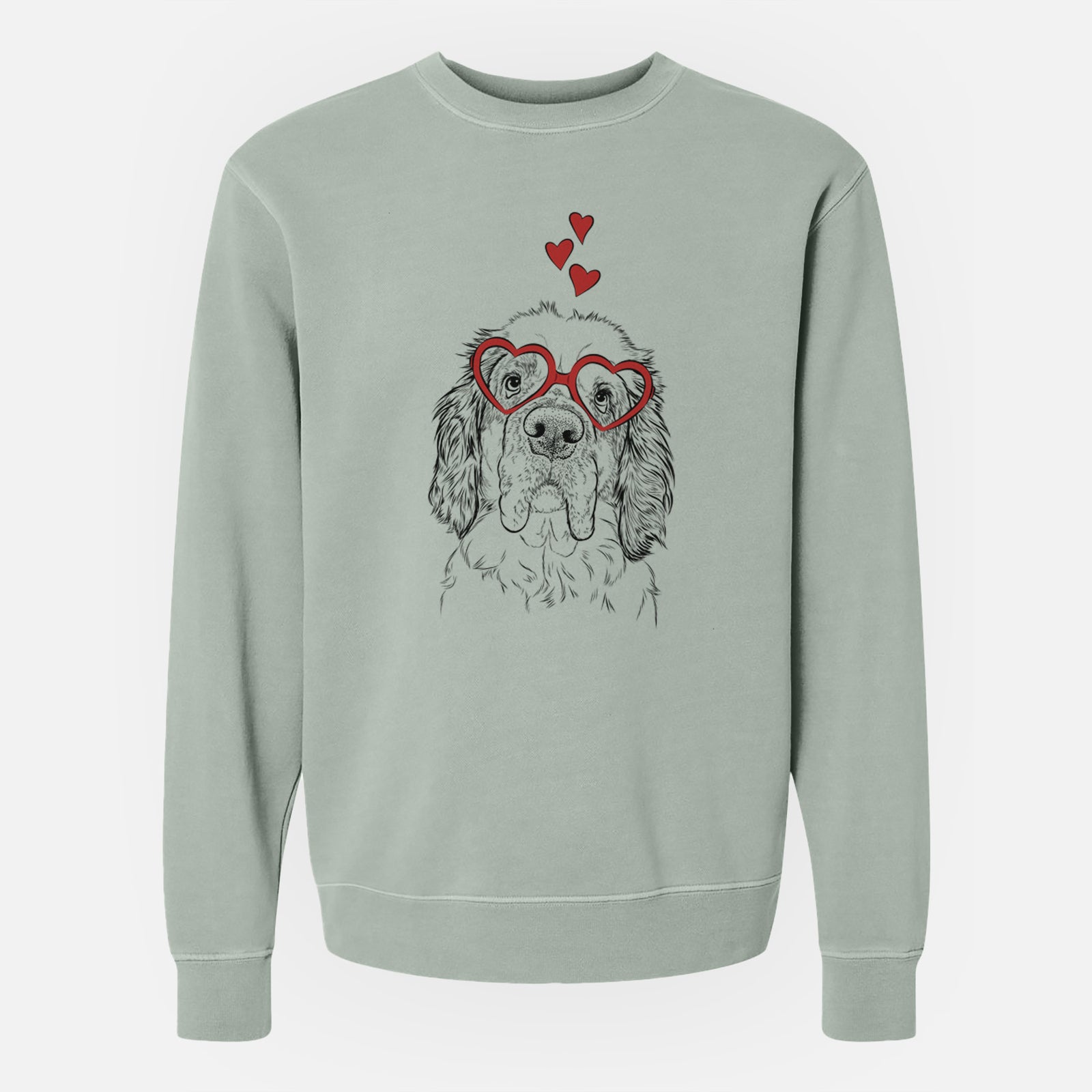 Hand-drawn sketch of Sully the Clumber Spaniel wearing heart-shaped glasses on a Sage Unisex pigment dyed crew sweatshirt