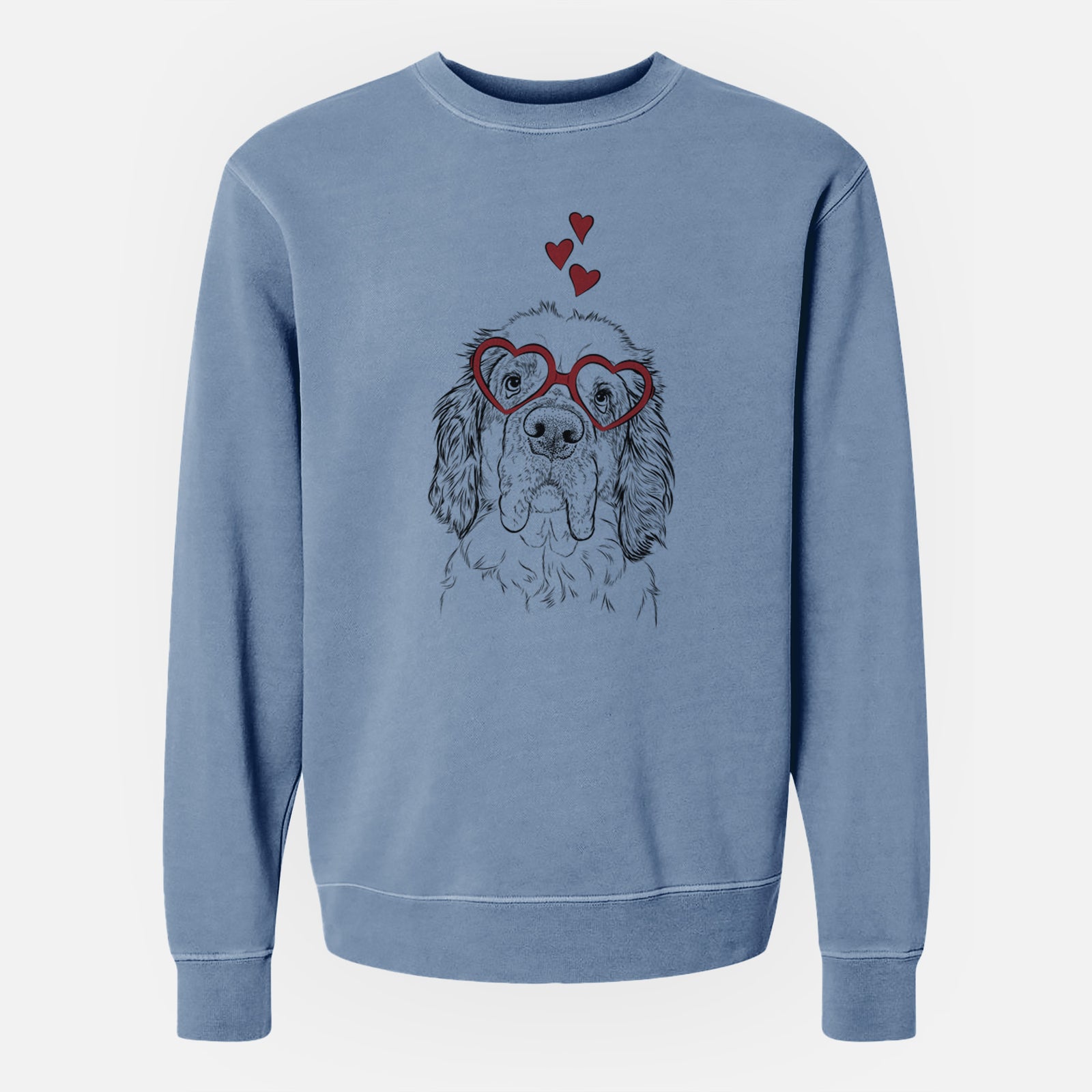 Hand-drawn sketch of Sully the Clumber Spaniel wearing heart-shaped glasses on a Slate Blue Unisex pigment dyed crew sweatshirt