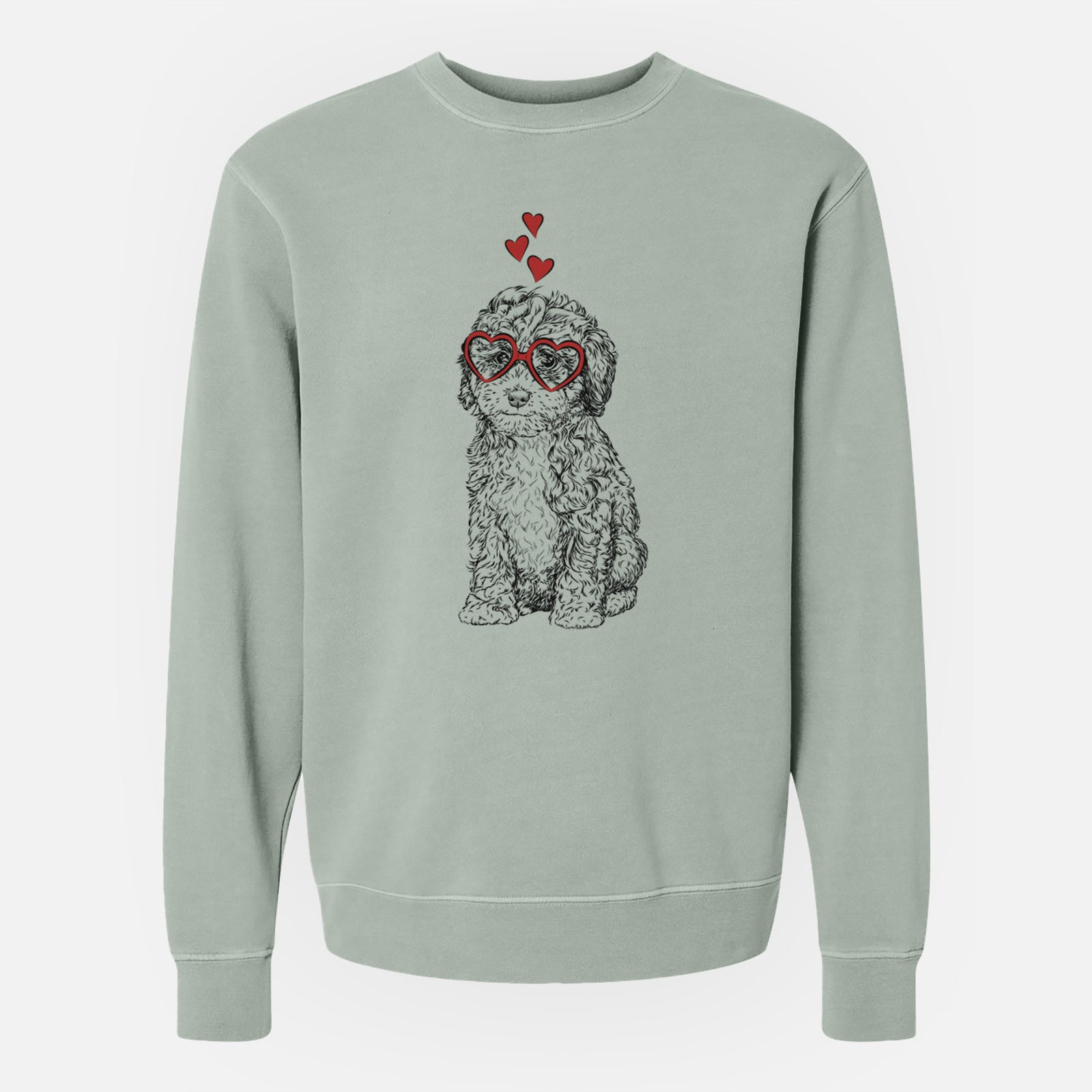 Hand-drawn sketch of Sweet Tea the Mini Doodle wearing heart-shaped glasses on a Sage Unisex pigment dyed crew sweatshirt