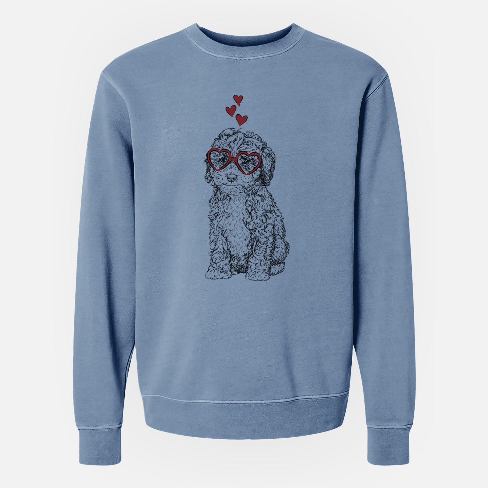 Hand-drawn sketch of Sweet Tea the Mini Doodle wearing heart-shaped glasses on a Slate Blue Unisex pigment dyed crew sweatshirt