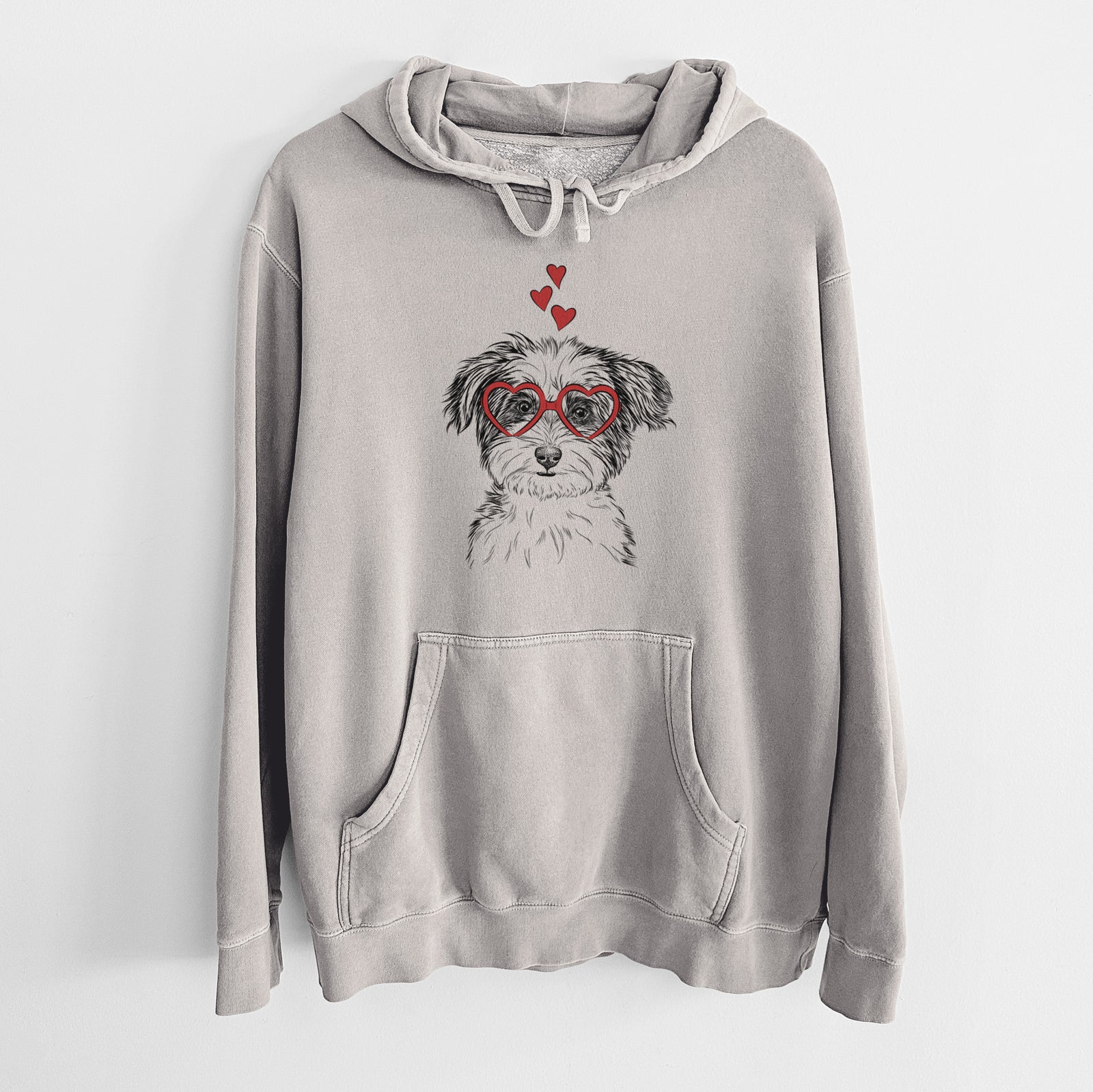 Hand-drawn sketch of Teddy the Havanese wearing heart-shaped glasses on a Cement Unisex pigment dyed hoodie