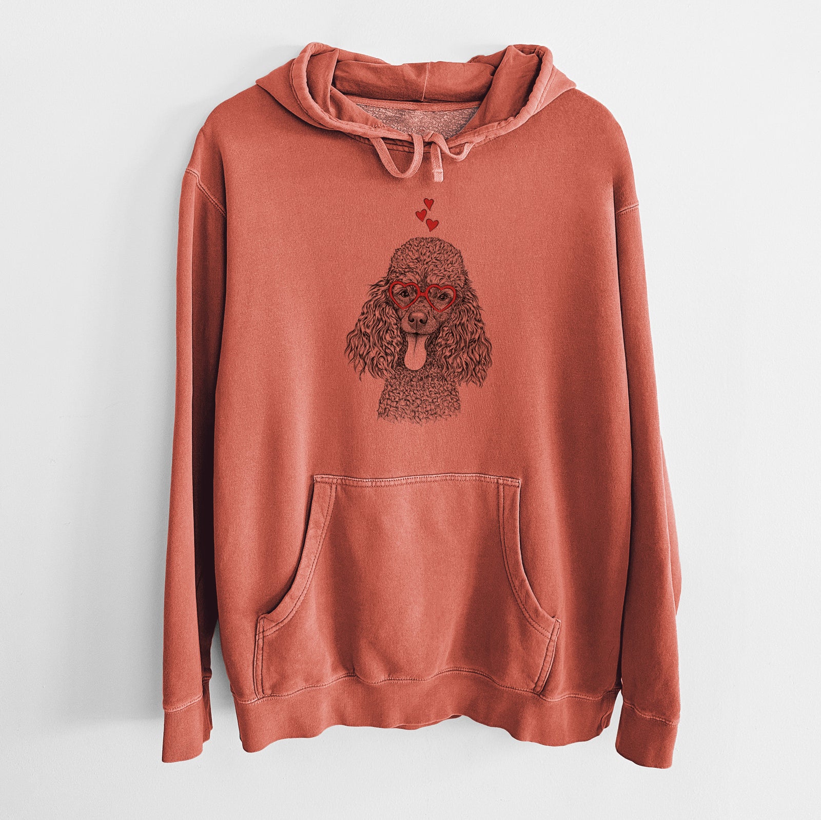 Hand-drawn sketch of Teddy the Mini Poodle wearing heart-shaped glasses on an Amber Unisex pigment dyed hoodie