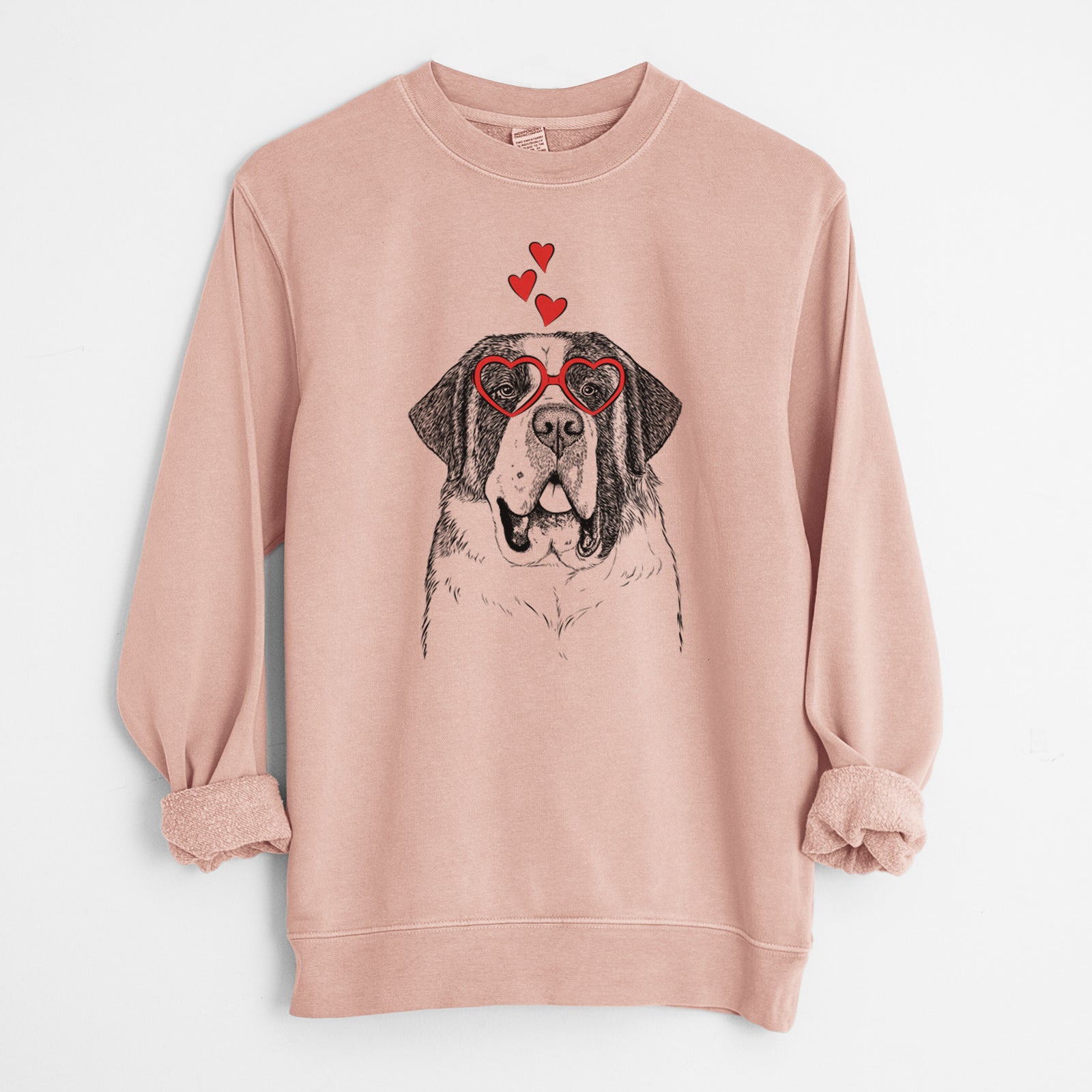 Hand-drawn sketch of Thor the Saint Bernard wearing heart-shaped glasses on a Dusty Pink Unisex pigment dyed crew sweatshirt