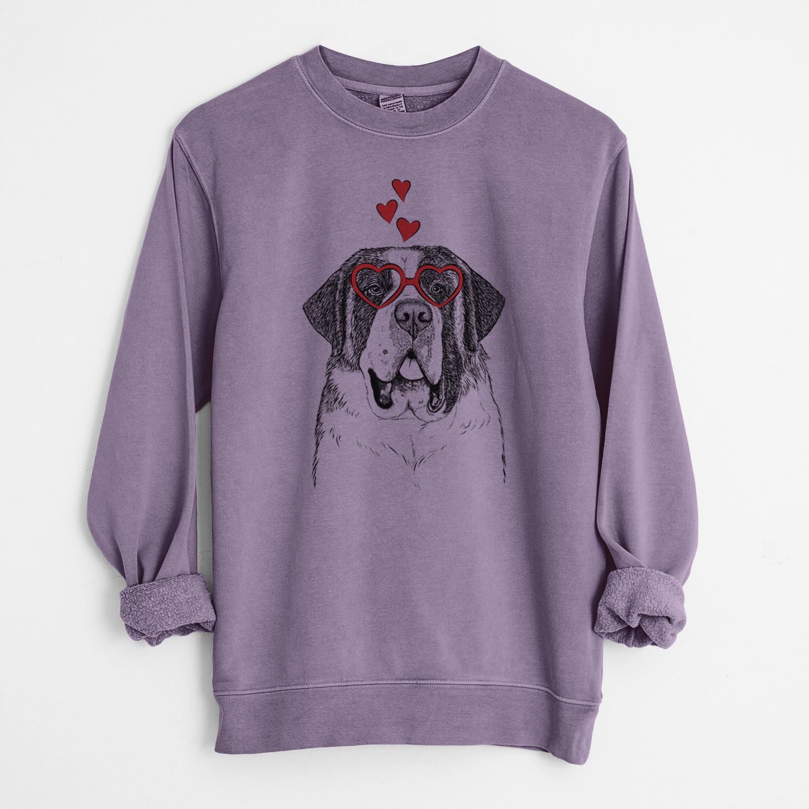 Hand-drawn sketch of Thor the Saint Bernard wearing heart-shaped glasses on a Plum Unisex pigment dyed crew sweatshirt