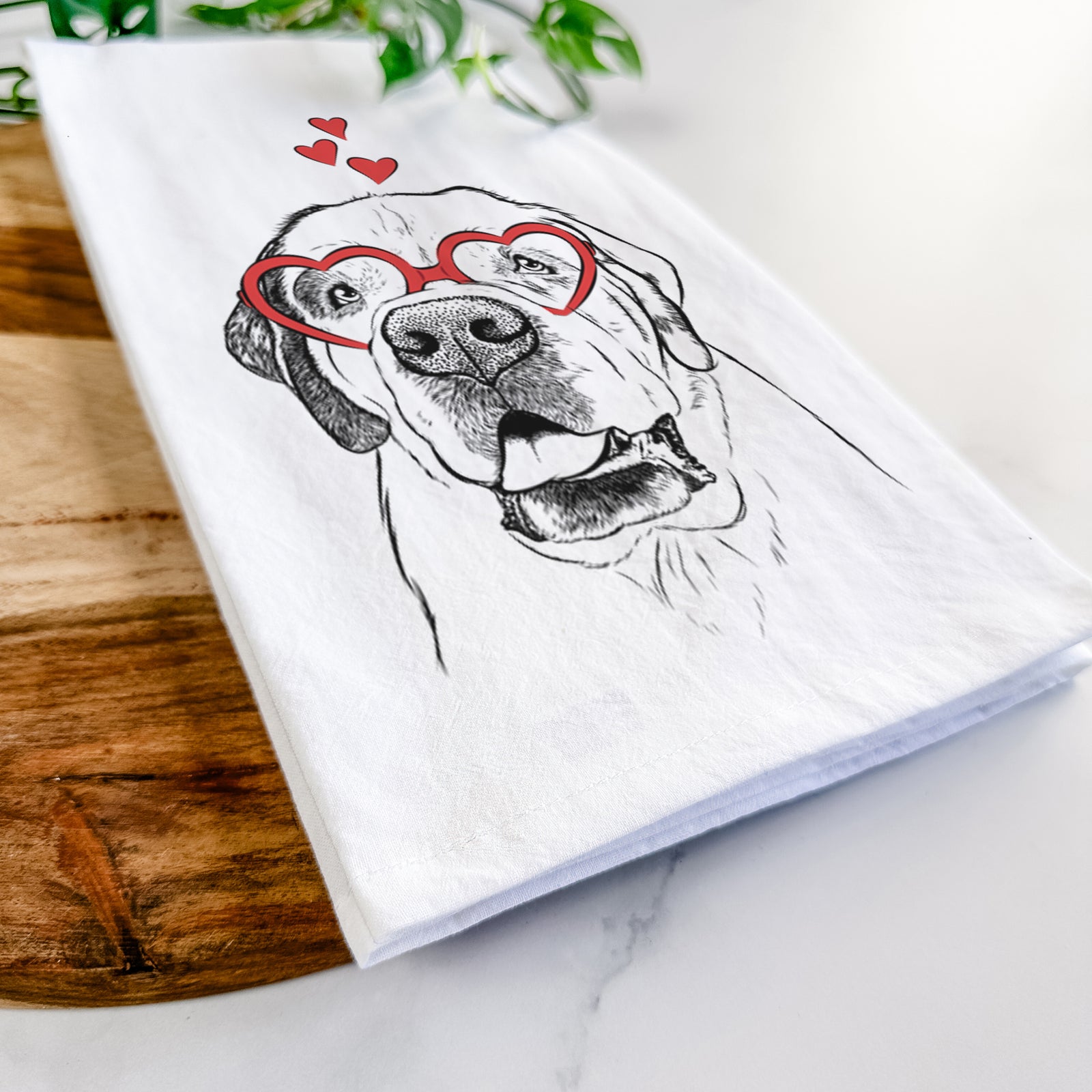 Hand-drawn sketch of Wendy the Saint Bernard wearing heart-shaped glasses on a tea towel