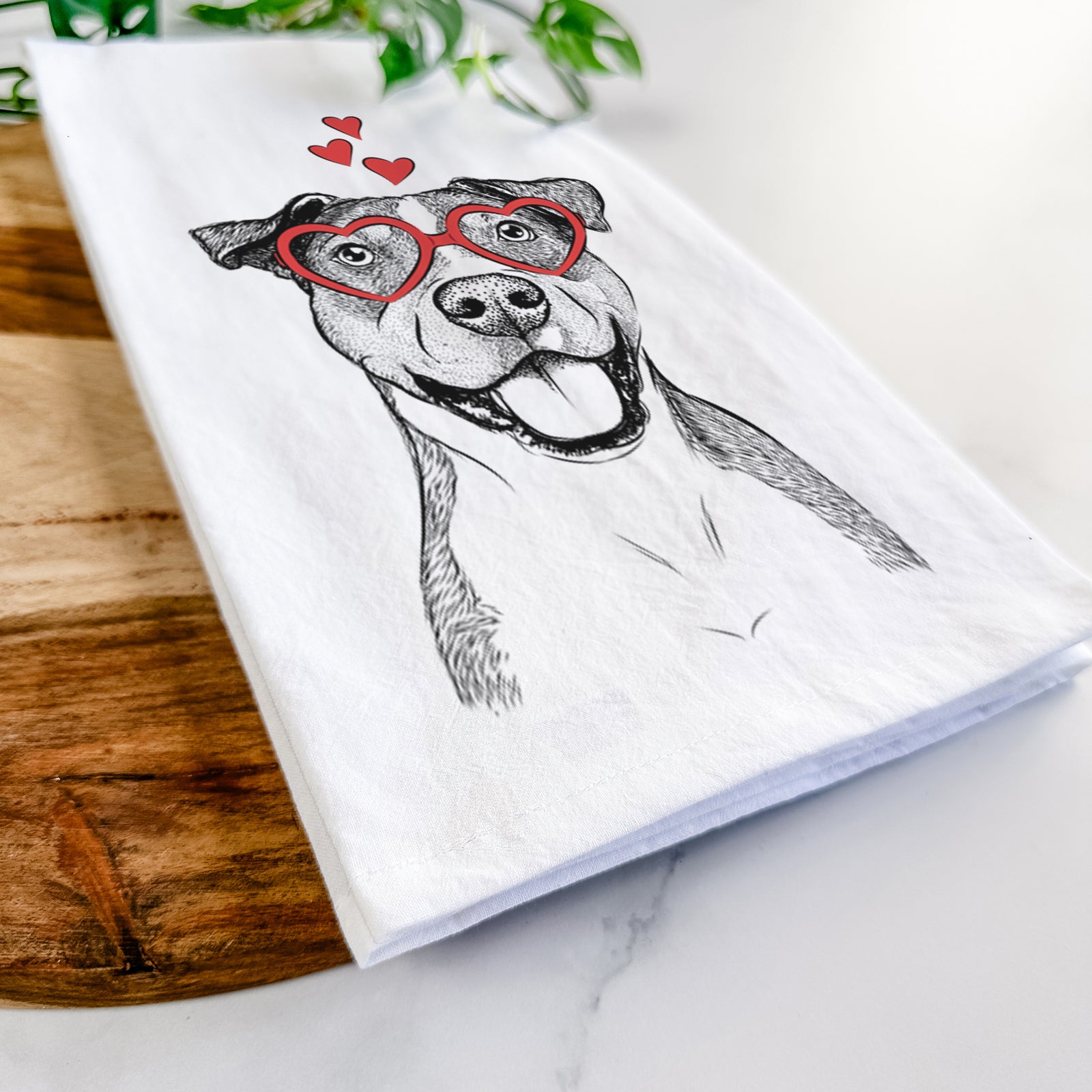 Hand-drawn sketch of Wendy the Mixed Breed wearing heart-shaped glasses on a tea towel