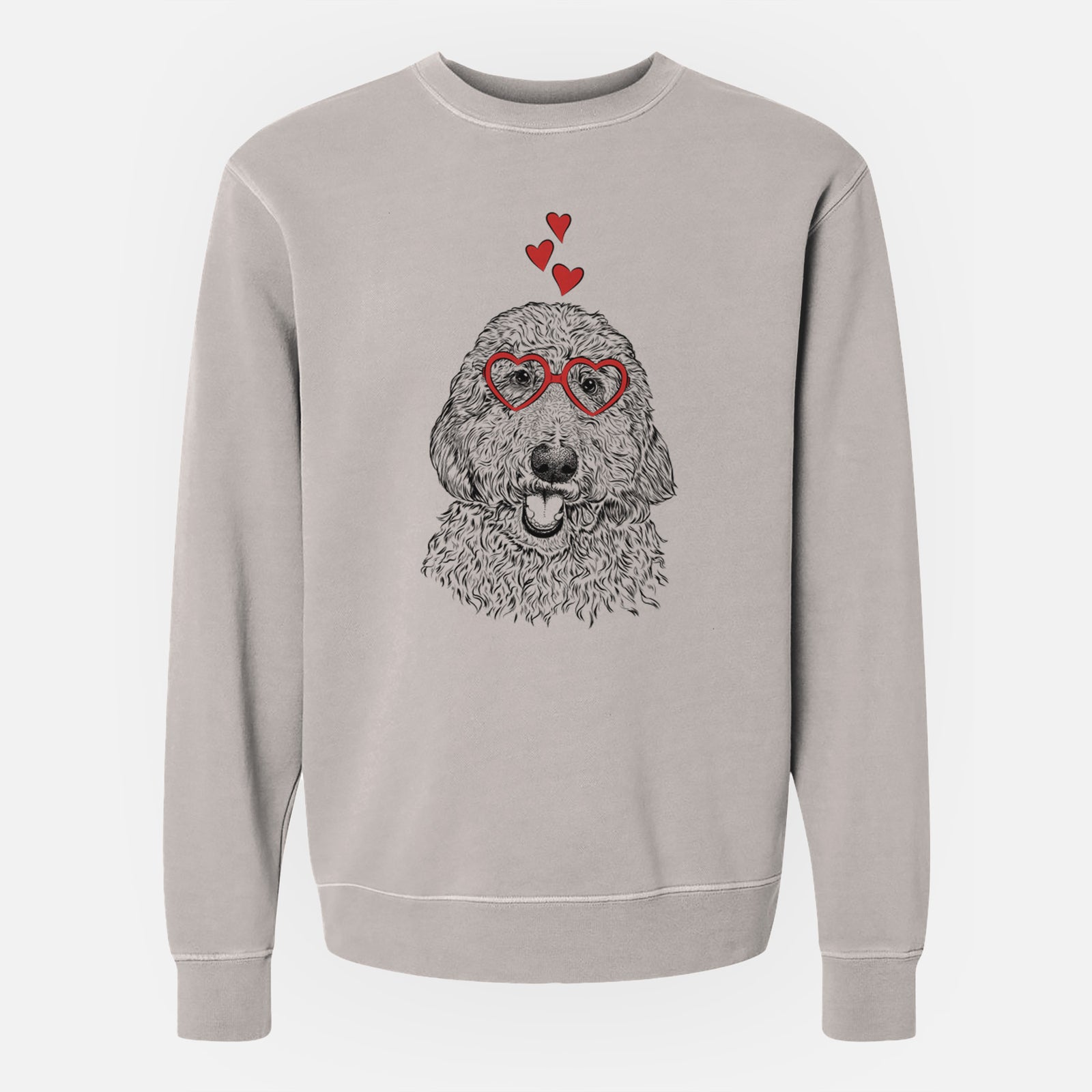 Hand-drawn sketch of Whisper the Goldendoodle wearing heart-shaped glasses on a Cement Unisex pigment dyed crew sweatshirt