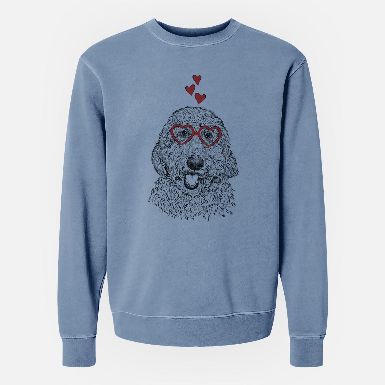 Hand-drawn sketch of Whisper the Goldendoodle wearing heart-shaped glasses on a Slate Blue Unisex pigment dyed crew sweatshirt