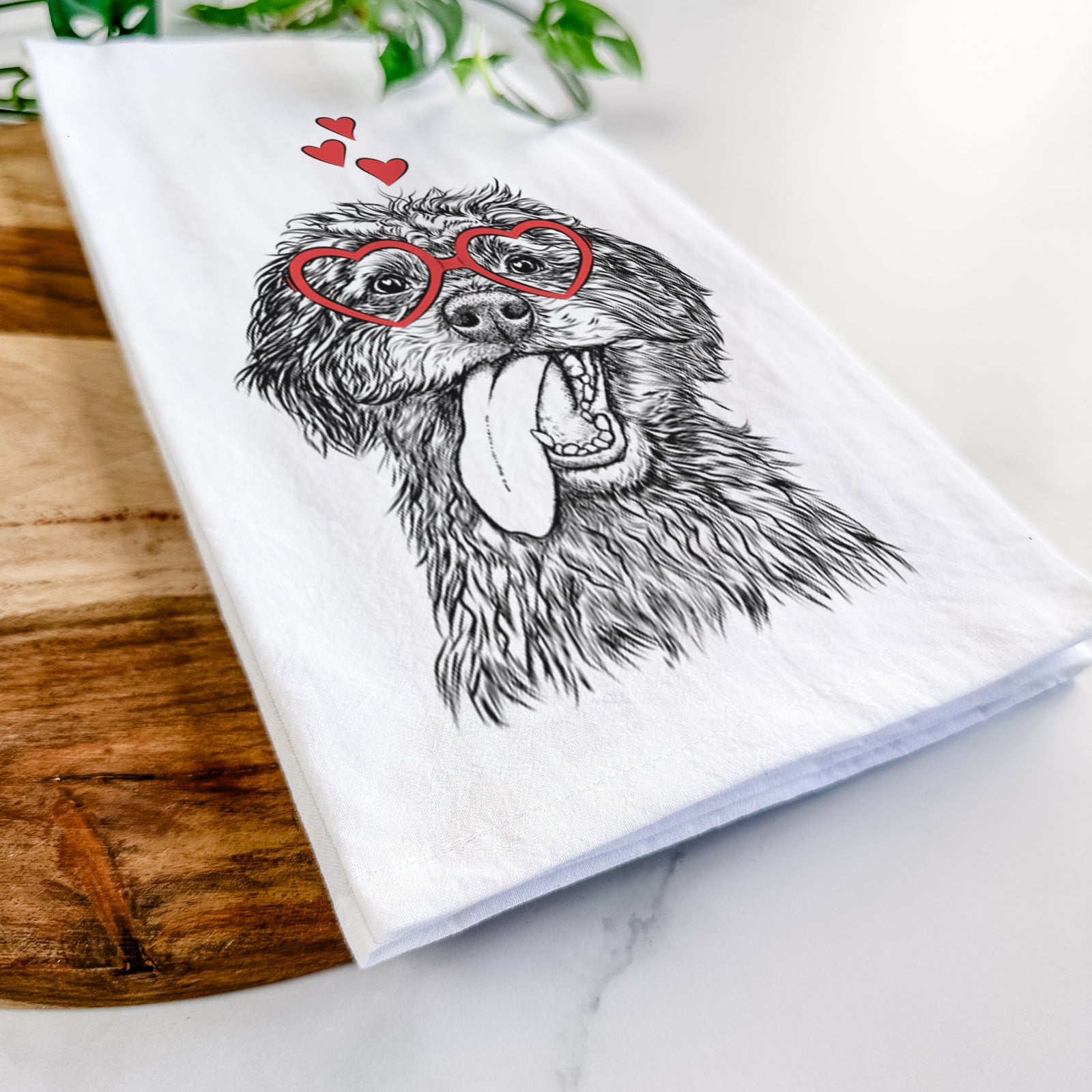 Hand-drawn sketch of Winnie the Mini Aussiedoodle wearing heart-shaped glasses on a tea towel