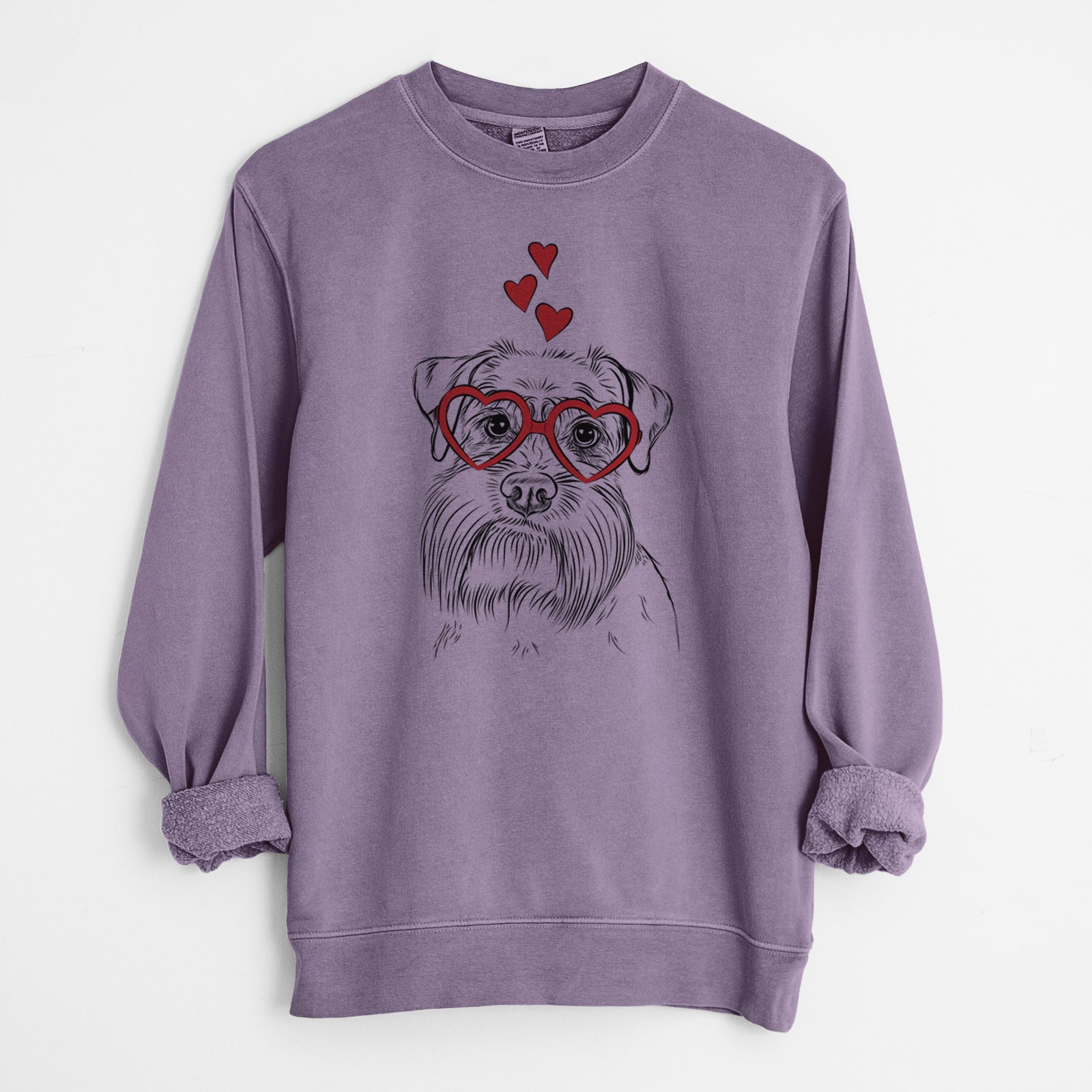 Hand-drawn sketch of Wrigley the Schnauzer wearing heart-shaped glasses on a Plum Unisex pigment dyed crew sweatshirt