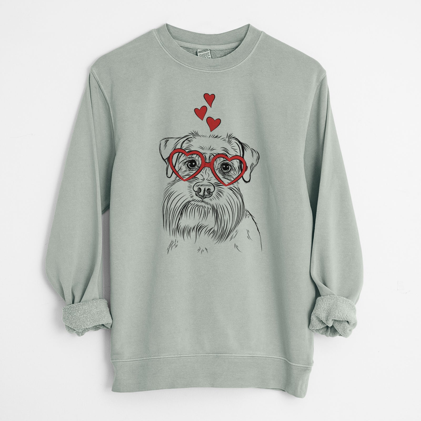 Hand-drawn sketch of Wrigley the Schnauzer wearing heart-shaped glasses on a Sage Unisex pigment dyed crew sweatshirt