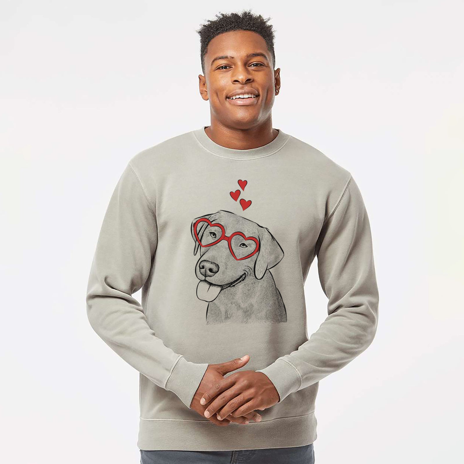 Hand-drawn sketch of Zeppelin the Black Labrador wearing heart-shaped glasses on a Cement Unisex pigment dyed crew sweatshirt