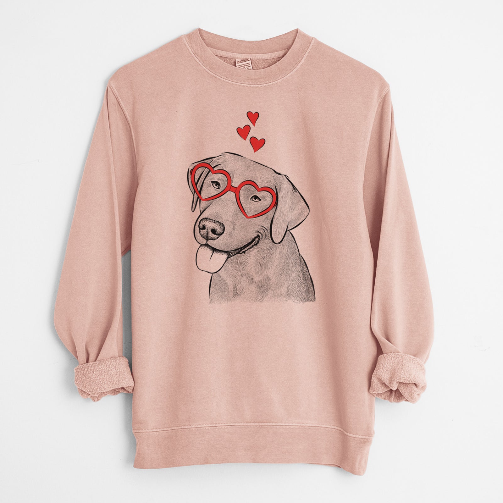 Hand-drawn sketch of Zeppelin the Black Labrador wearing heart-shaped glasses on a Dusty Pink Unisex pigment dyed crew sweatshirt