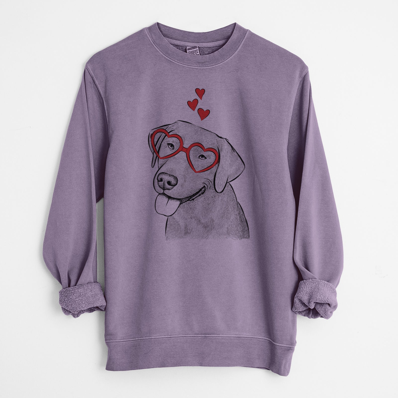 Hand-drawn sketch of Zeppelin the Black Labrador wearing heart-shaped glasses on a Plum Unisex pigment dyed crew sweatshirt