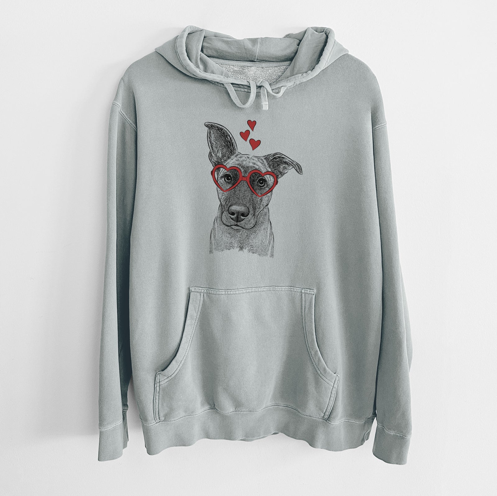 Hand-drawn sketch of Zoey the Mixed Breed wearing heart-shaped glasses on a Sage Unisex pigment dyed hoodie