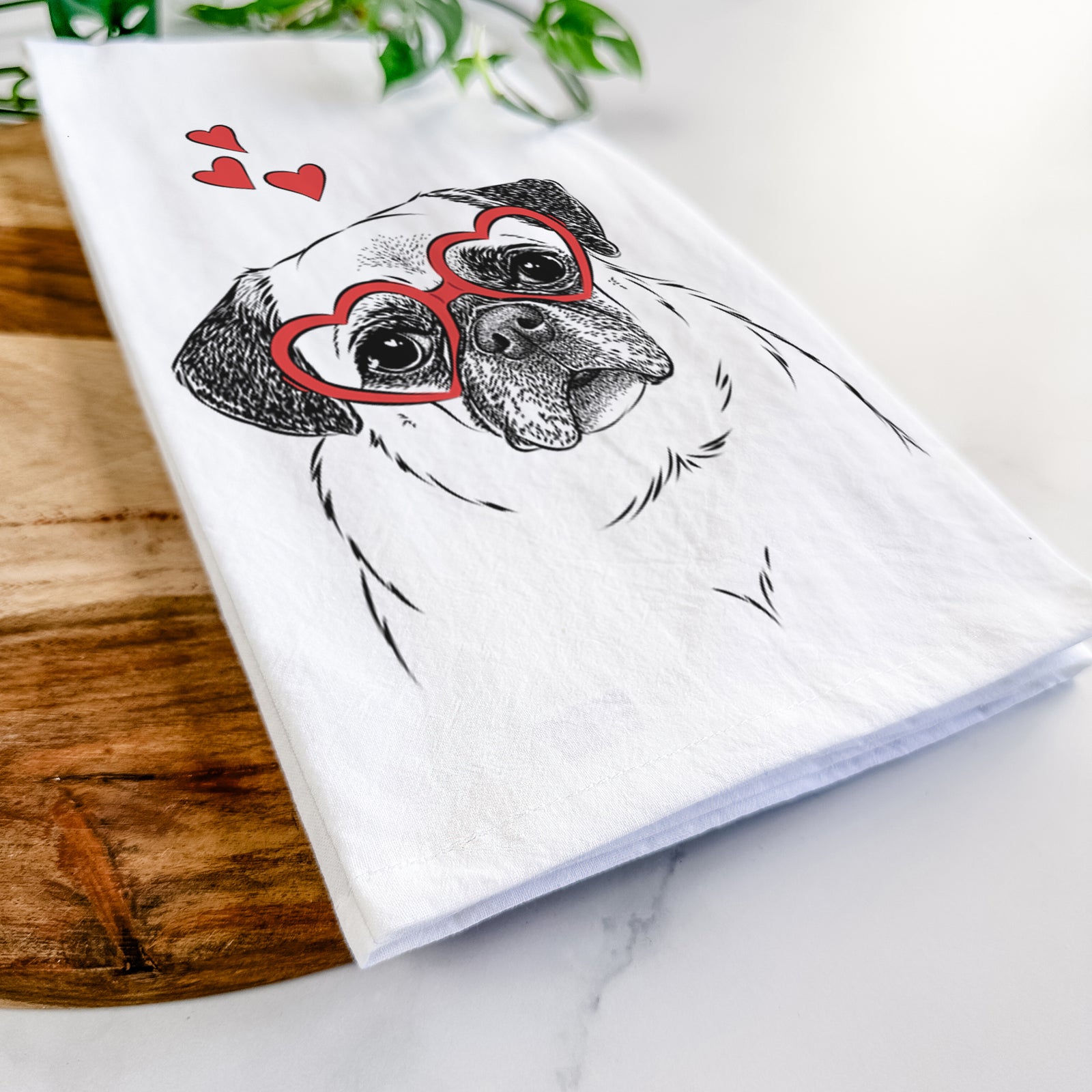 Hand-drawn sketch of Zoey the Pug wearing heart-shaped glasses on a tea towel