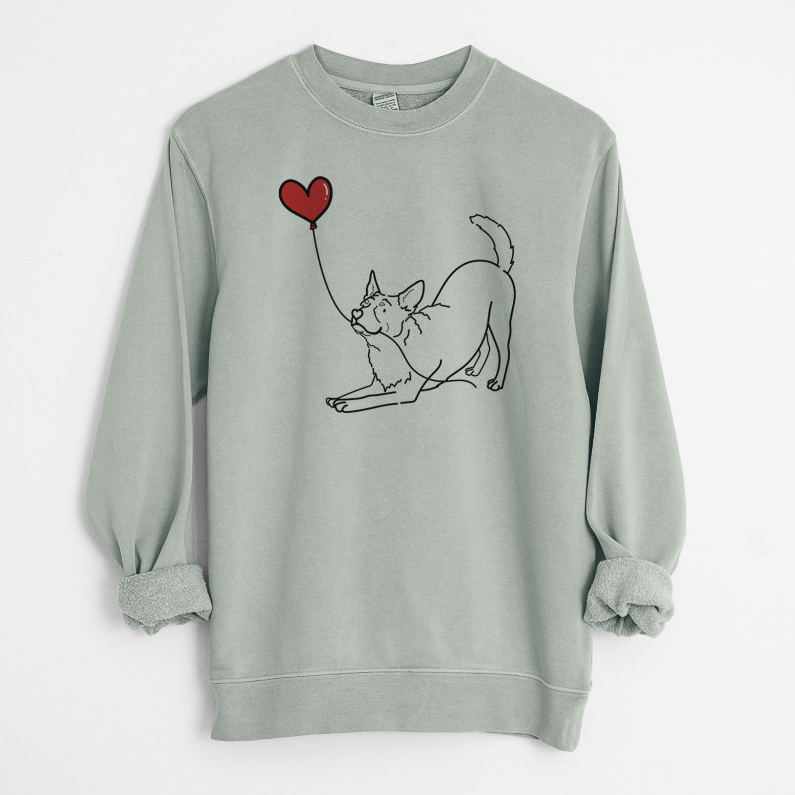 Minimalist line drawing of an Australian Cattle Dog Heart String holding a heart balloon on a Sage Unisex pigment dyed crew sweatshirt