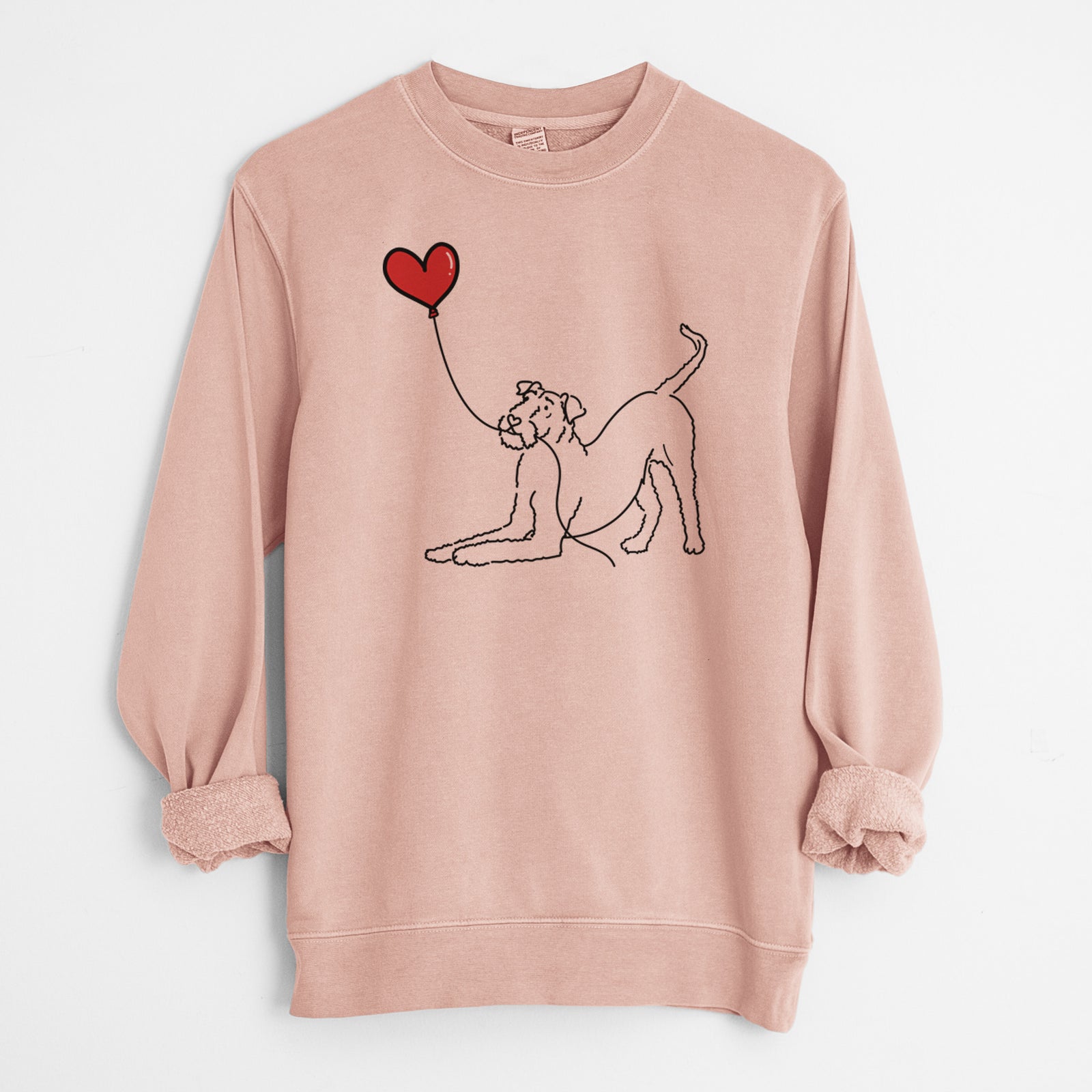 Minimalist line drawing of an Airedale Terrier Heart String holding a heart balloon on a Dusty Pink Unisex pigment dyed crew sweatshirt