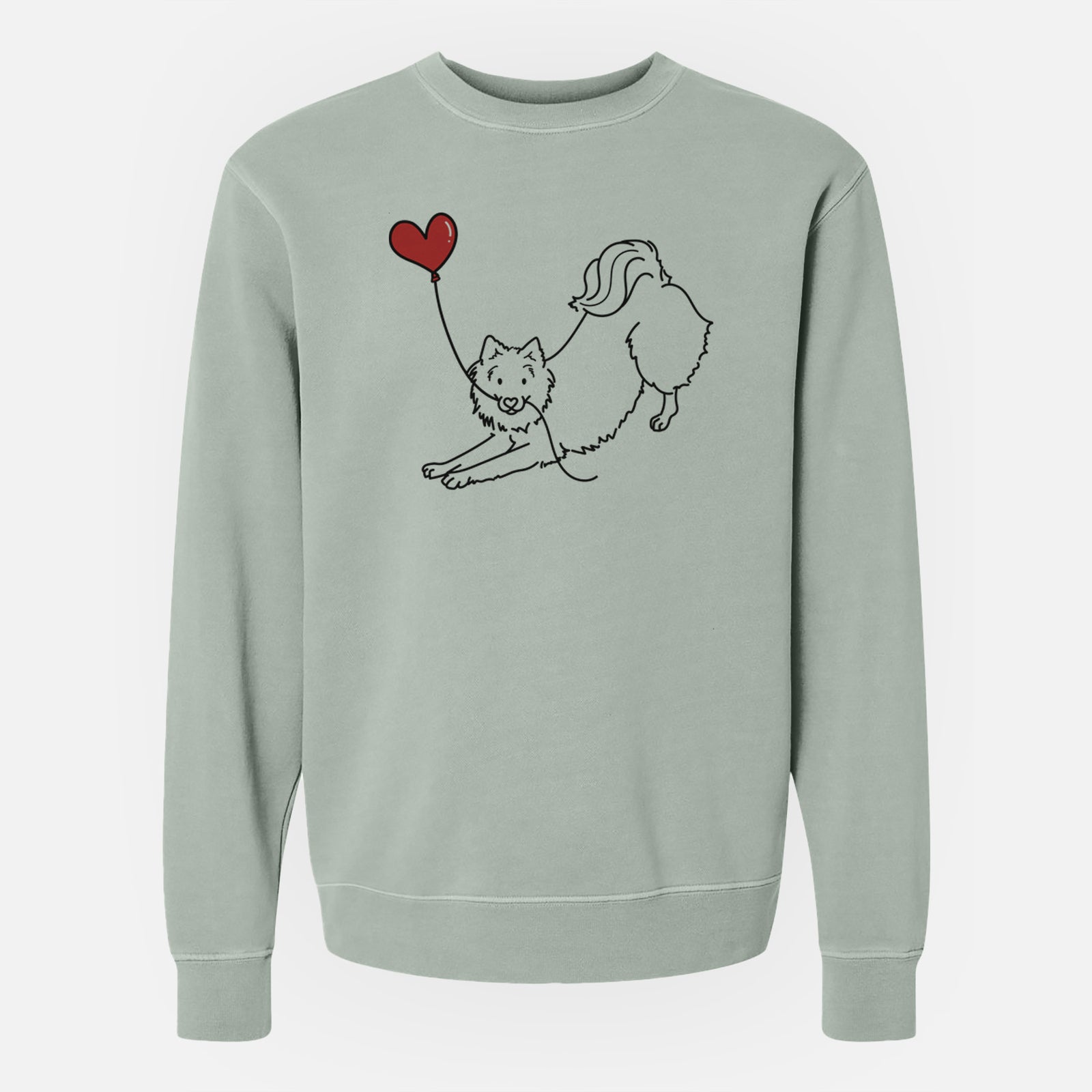 Minimalist line drawing of an American Eskimo Heart String holding a heart balloon on a Sage Unisex pigment dyed crew sweatshirt