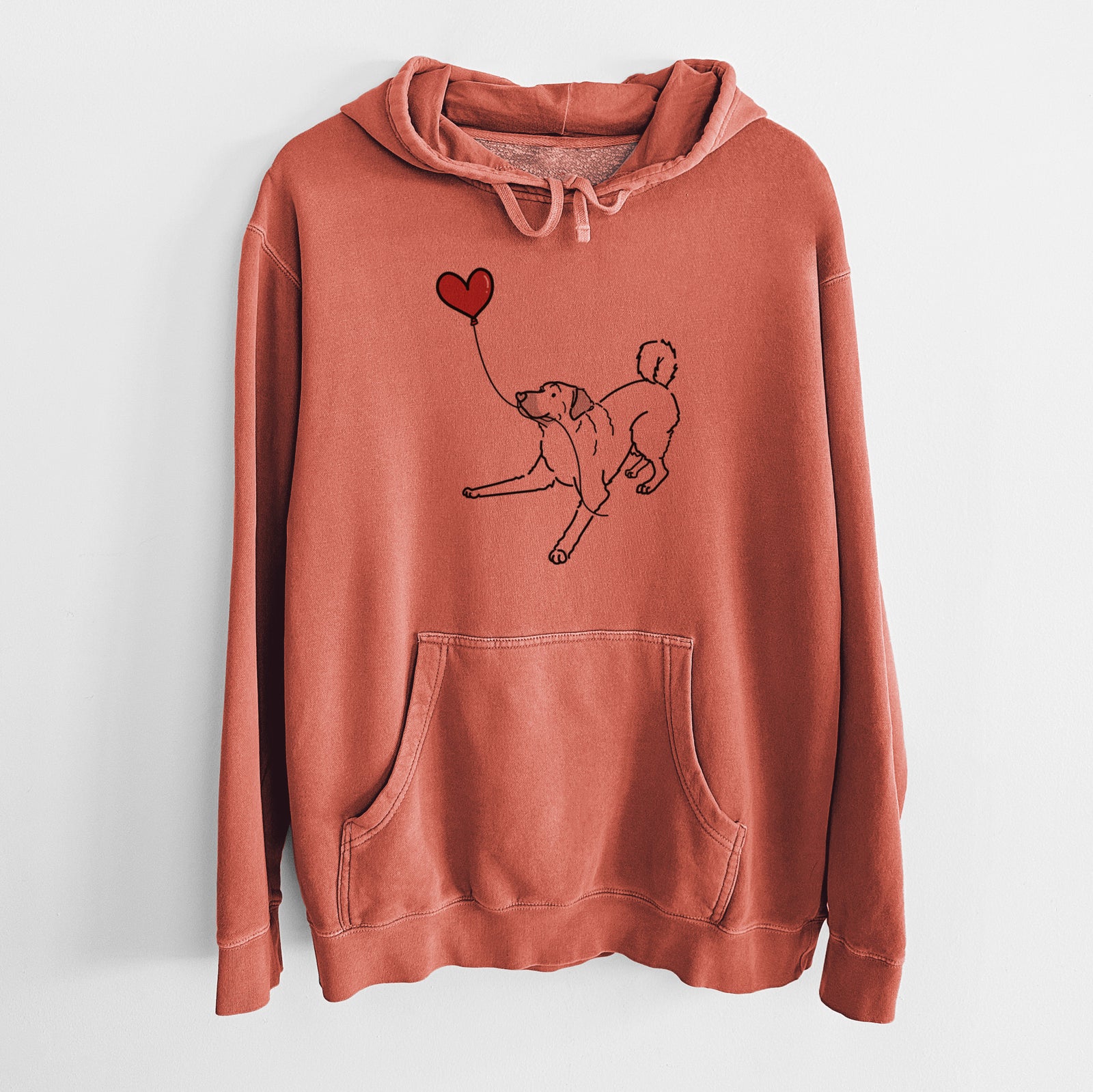 Minimalist line drawing of an Anatolian Shepherd Heart String holding a heart balloon on an Amber Unisex pigment dyed hoodie
